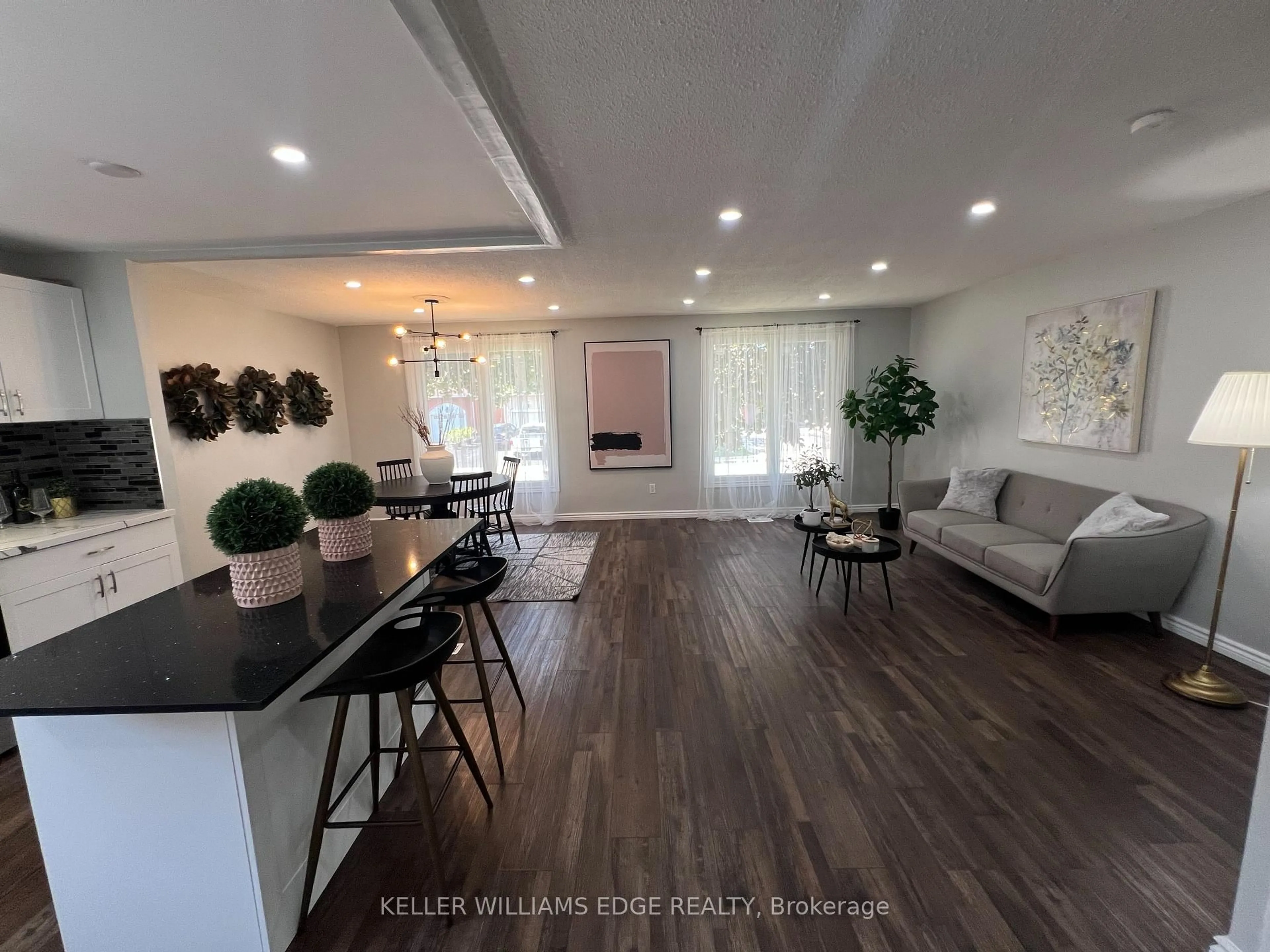 Living room with furniture, wood/laminate floor for 228 Lawnhurst Crt, Hamilton Ontario L8V 4R4