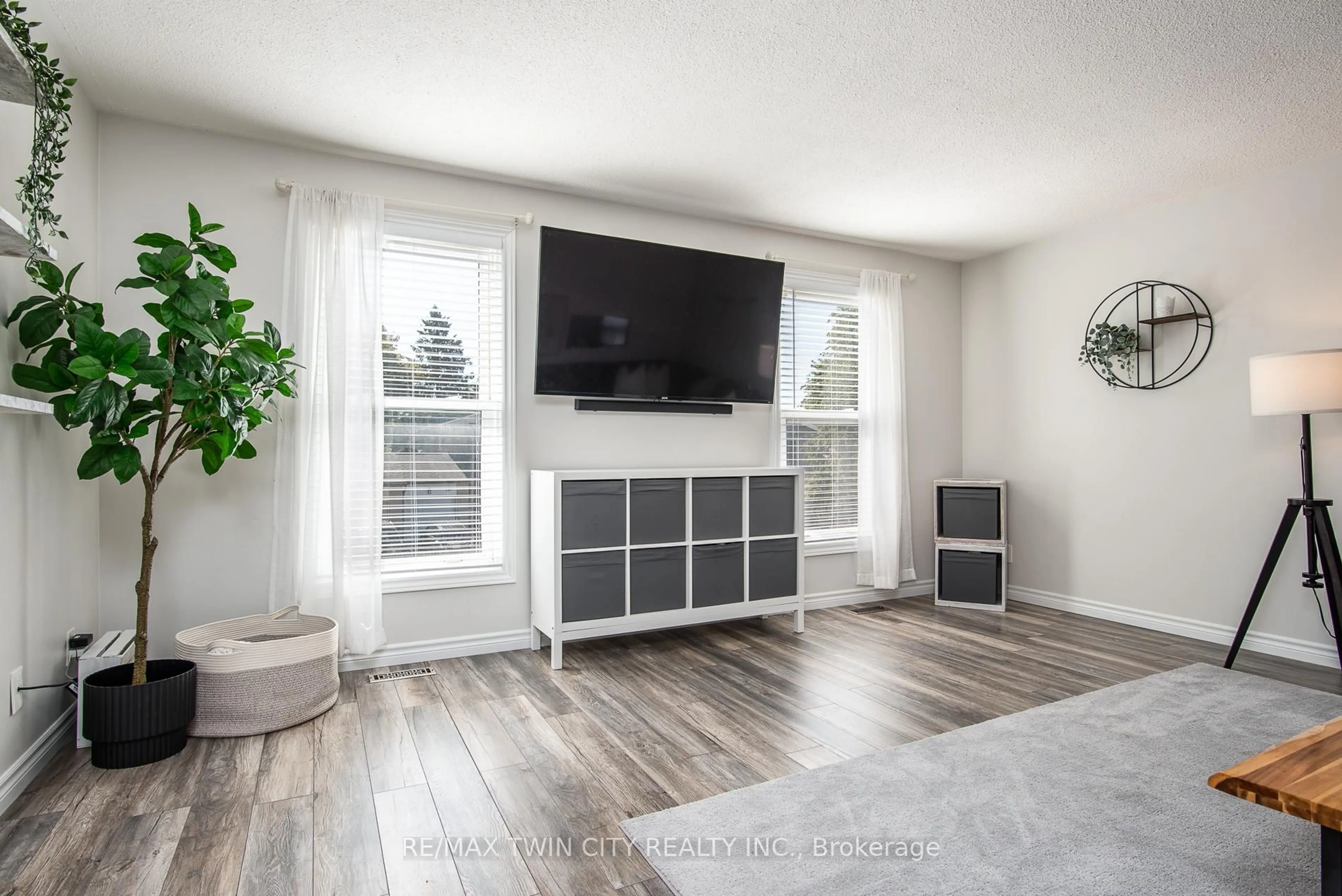 Living room with furniture, wood/laminate floor for 197 Silver Aspen Cres, Kitchener Ontario N2N 1H5
