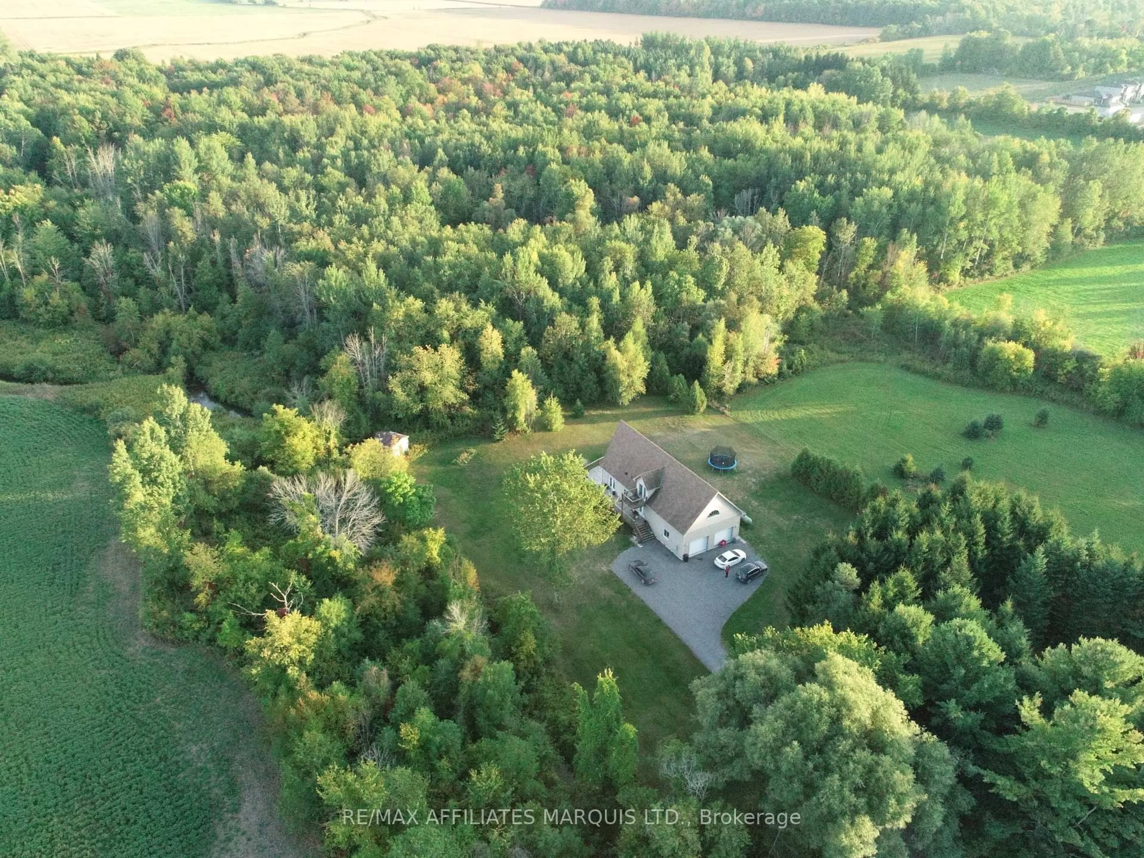 A pic from outside/outdoor area/front of a property/back of a property/a pic from drone, forest/trees view for 35 Nevada St, North Stormont Ontario K0C 1W0