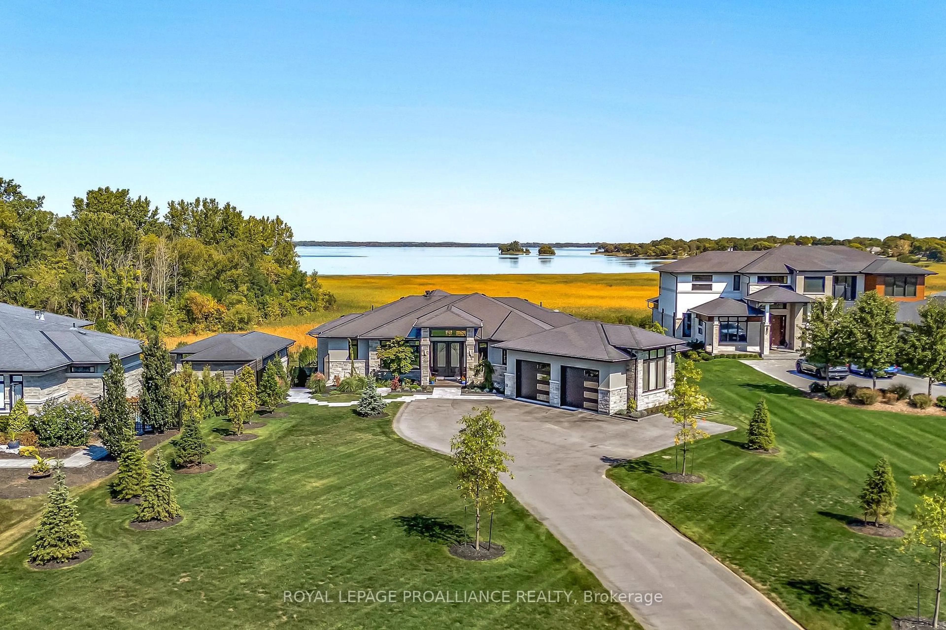 A pic from outside/outdoor area/front of a property/back of a property/a pic from drone, water/lake/river/ocean view for 77 Navigation Dr, Prince Edward County Ontario K0K 1H0