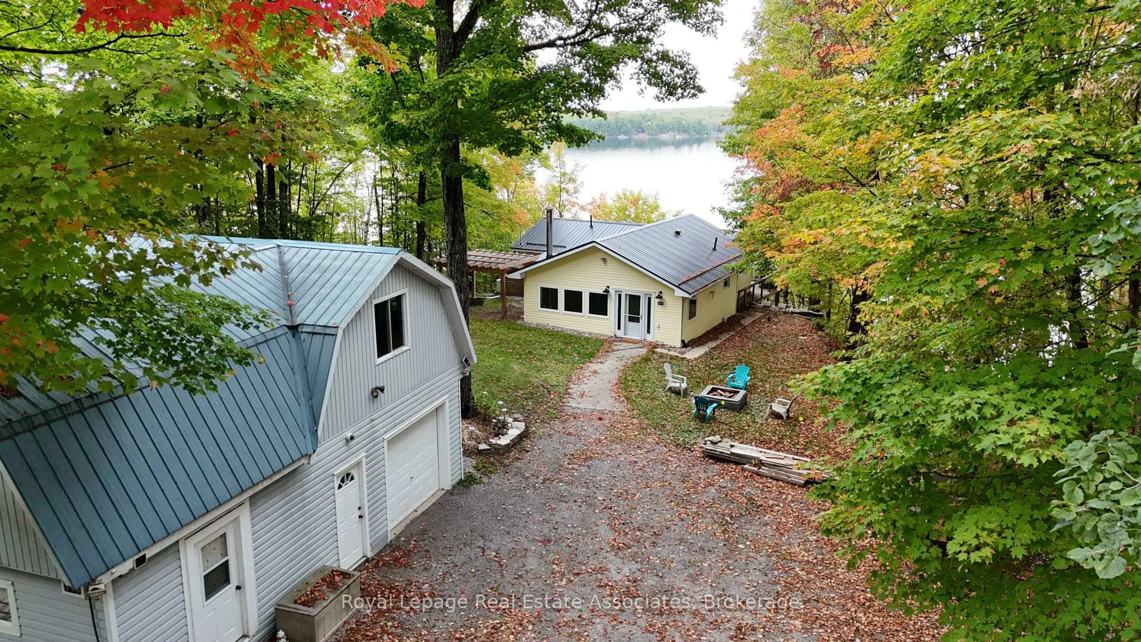 A pic from outside/outdoor area/front of a property/back of a property/a pic from drone, water/lake/river/ocean view for 398 Gilbert Bay Lane, Coe Hill Ontario K0L 1P0