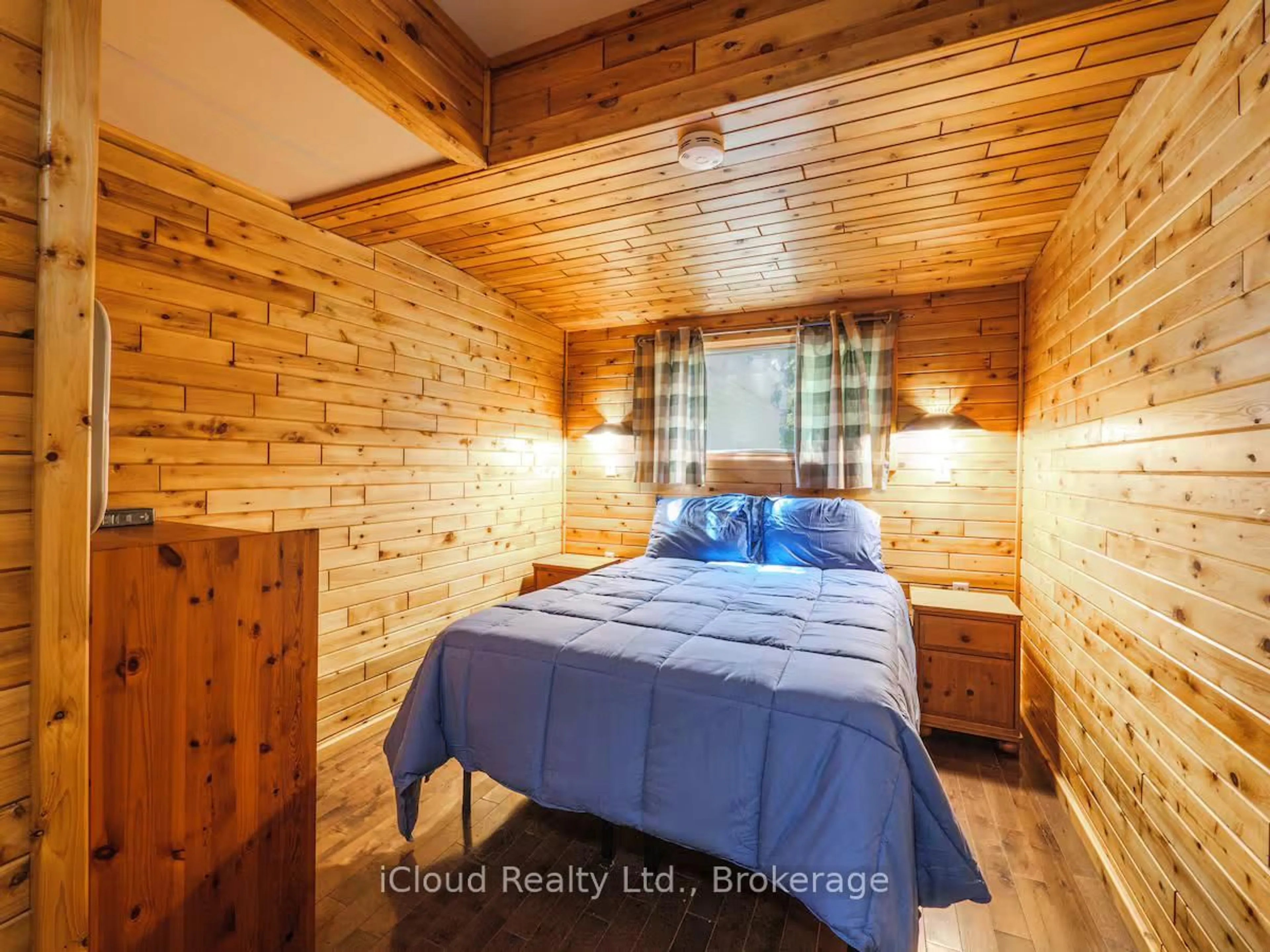 Bedroom with bed, wood/laminate floor for 7461 Hwy 6, Northern Bruce Peninsula Ontario N0H 2R0