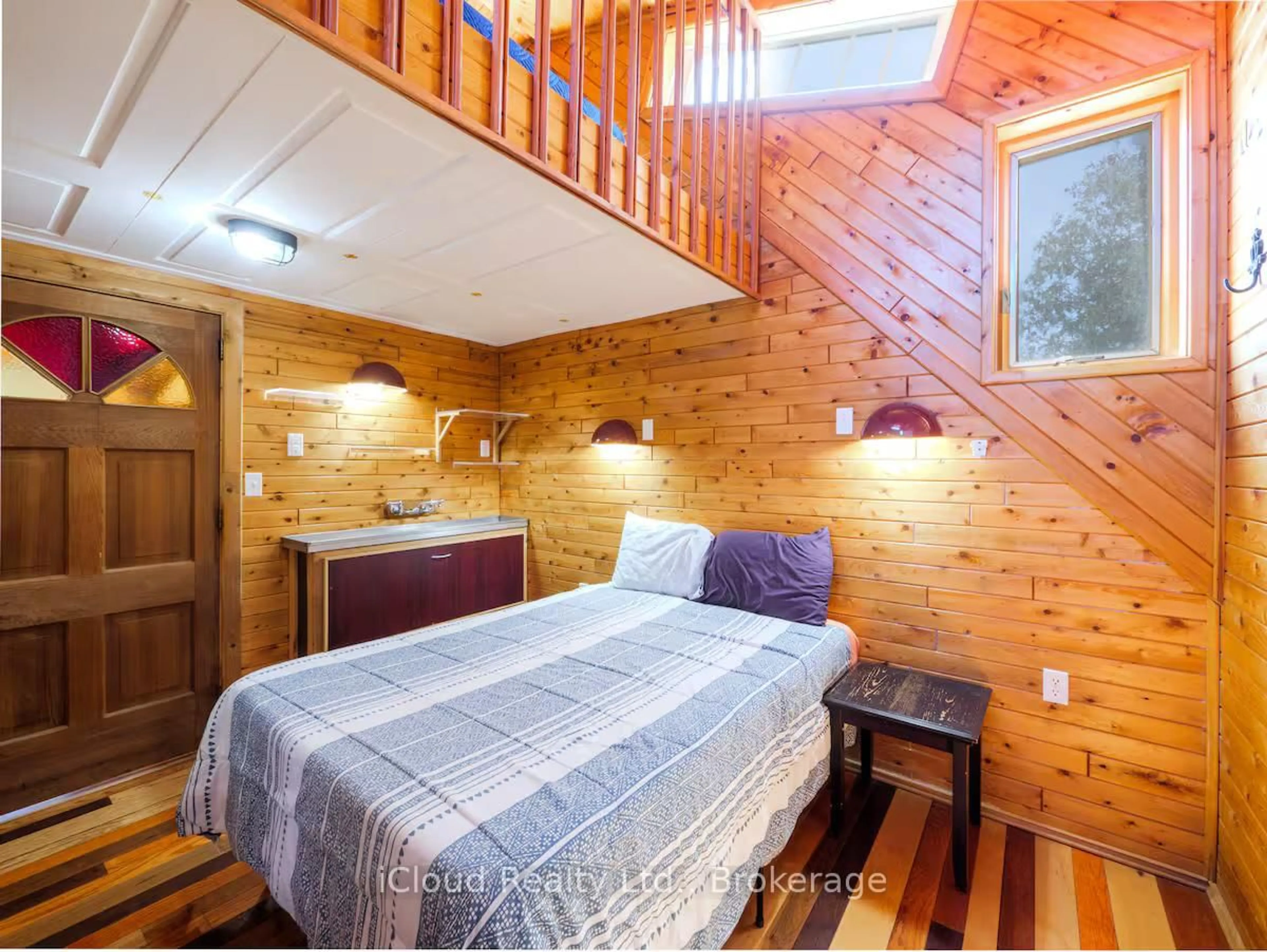 Bedroom with bed, wood/laminate floor for 7461 Hwy 6, Northern Bruce Peninsula Ontario N0H 2R0