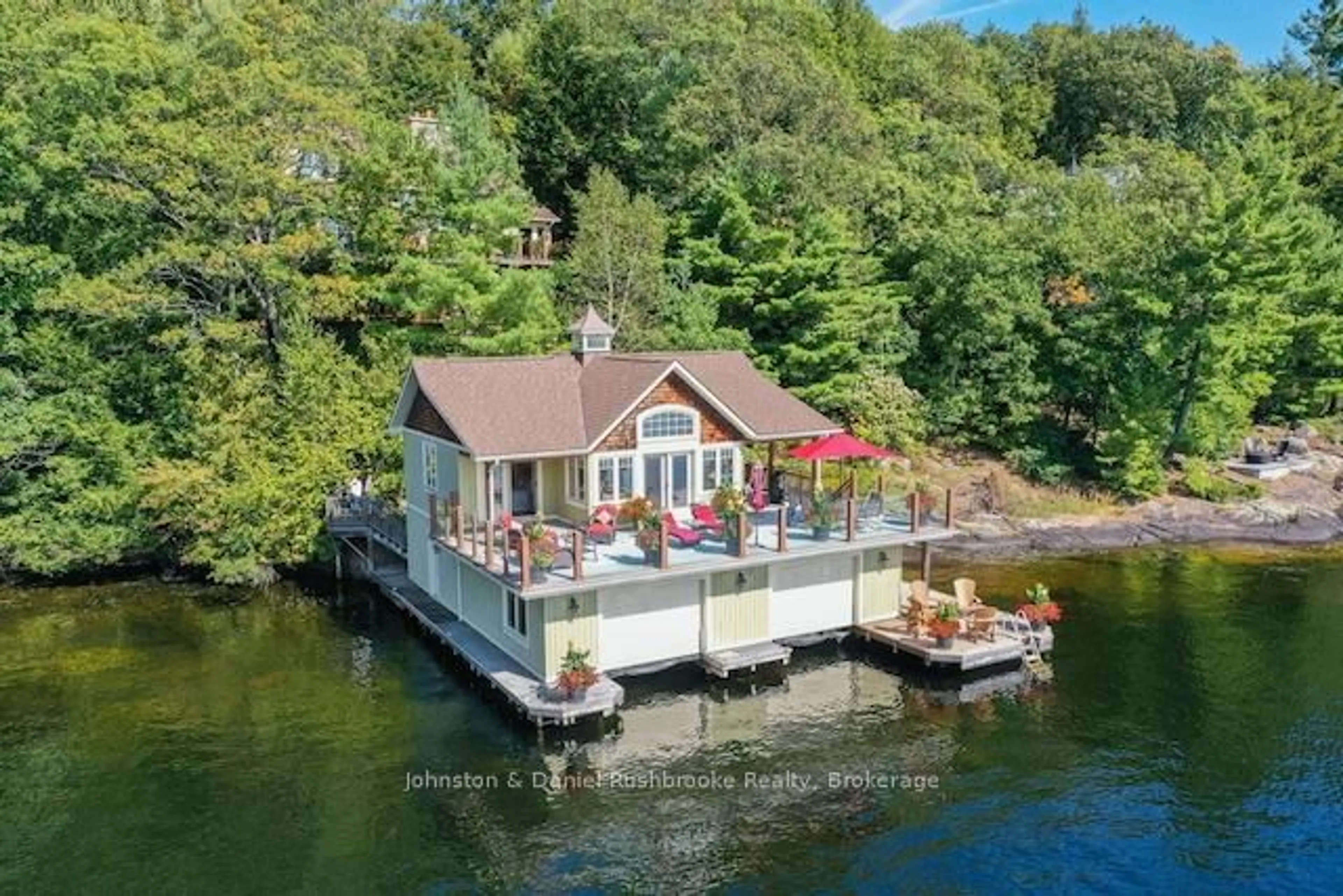 A pic from outside/outdoor area/front of a property/back of a property/a pic from drone, water/lake/river/ocean view for 1030 Marquis Lane, Muskoka Lakes Ontario P0B 1J0