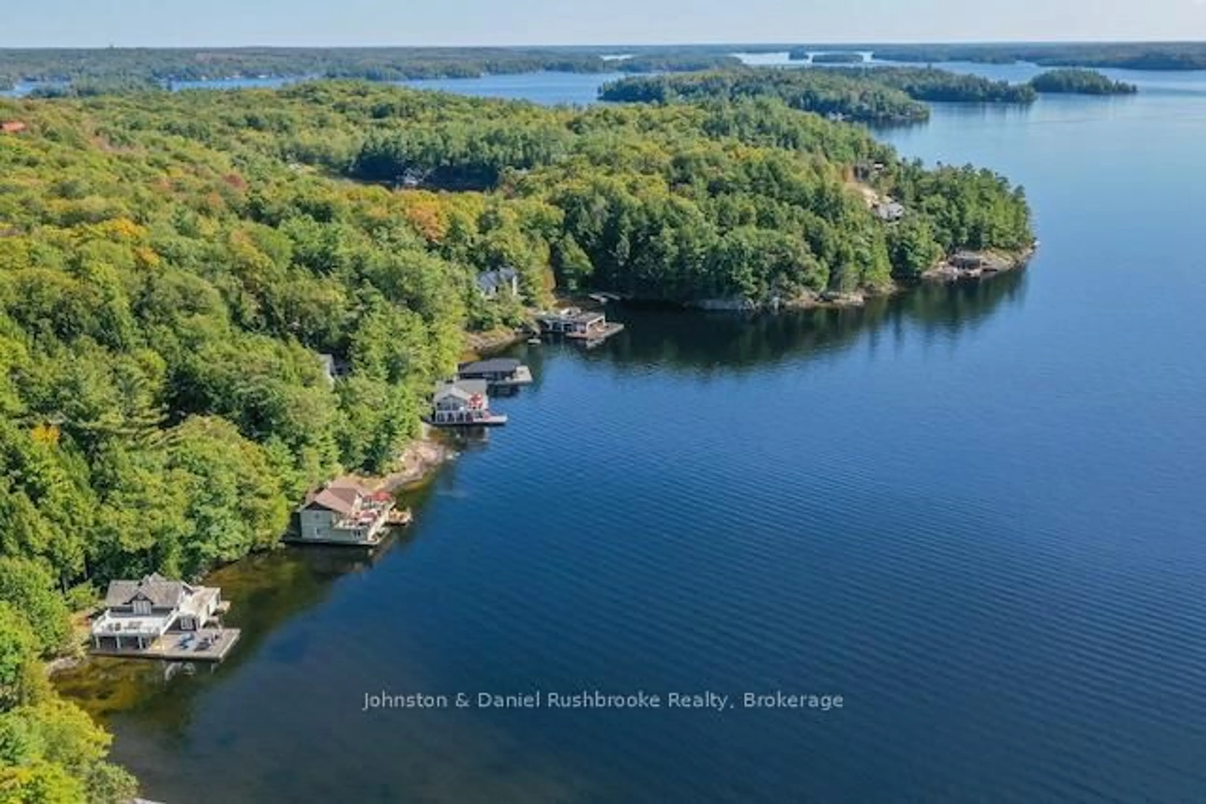 A pic from outside/outdoor area/front of a property/back of a property/a pic from drone, water/lake/river/ocean view for 1030 Marquis Lane, Muskoka Lakes Ontario P0B 1J0