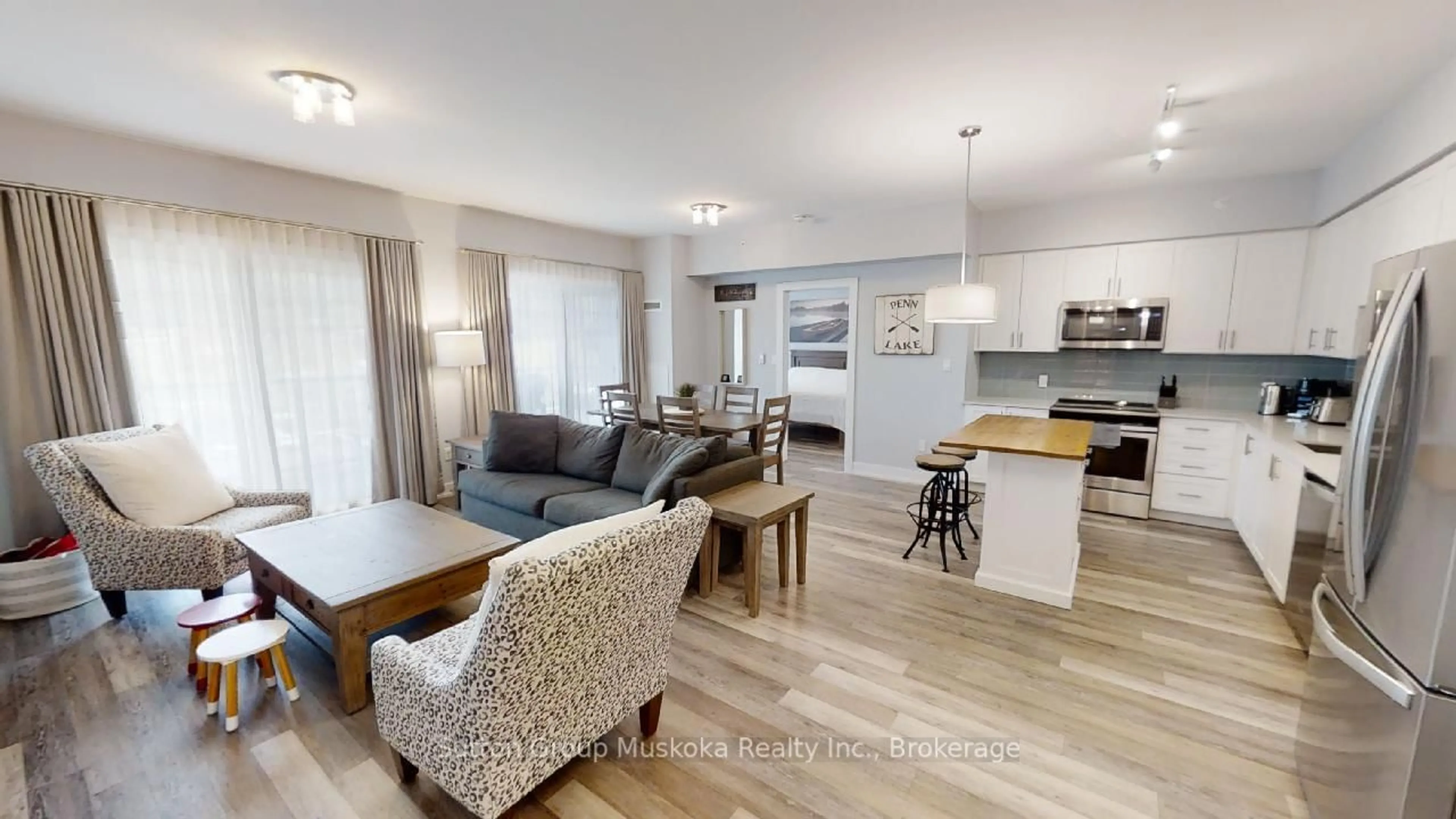 Open concept kitchen, wood/laminate floor for 25 Pen Lake Point Rd #318, Huntsville Ontario P1H 2E8
