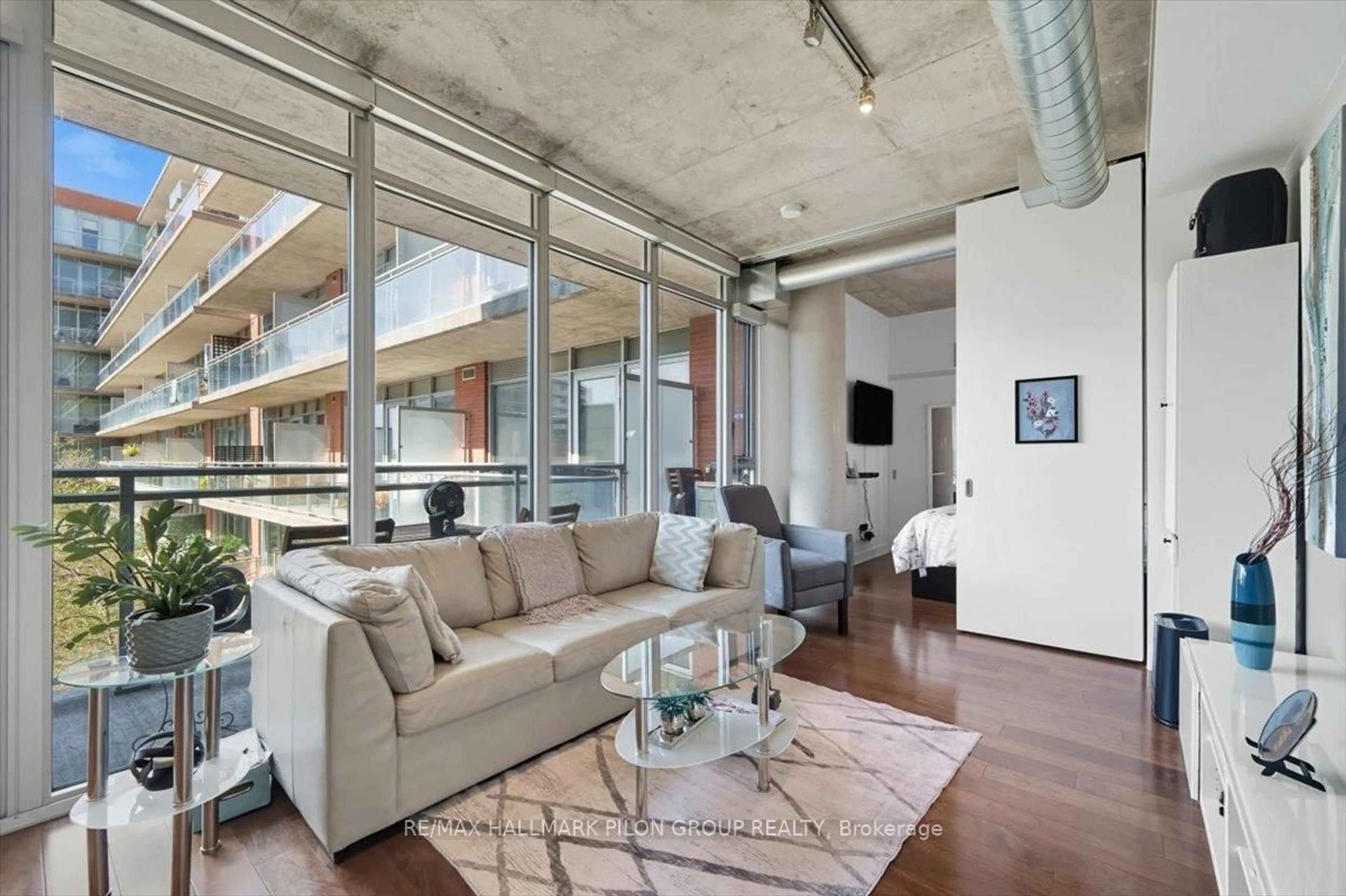 Living room with furniture, cement floor for 340 Mcleod St #450, Ottawa Ontario K2P 1A4