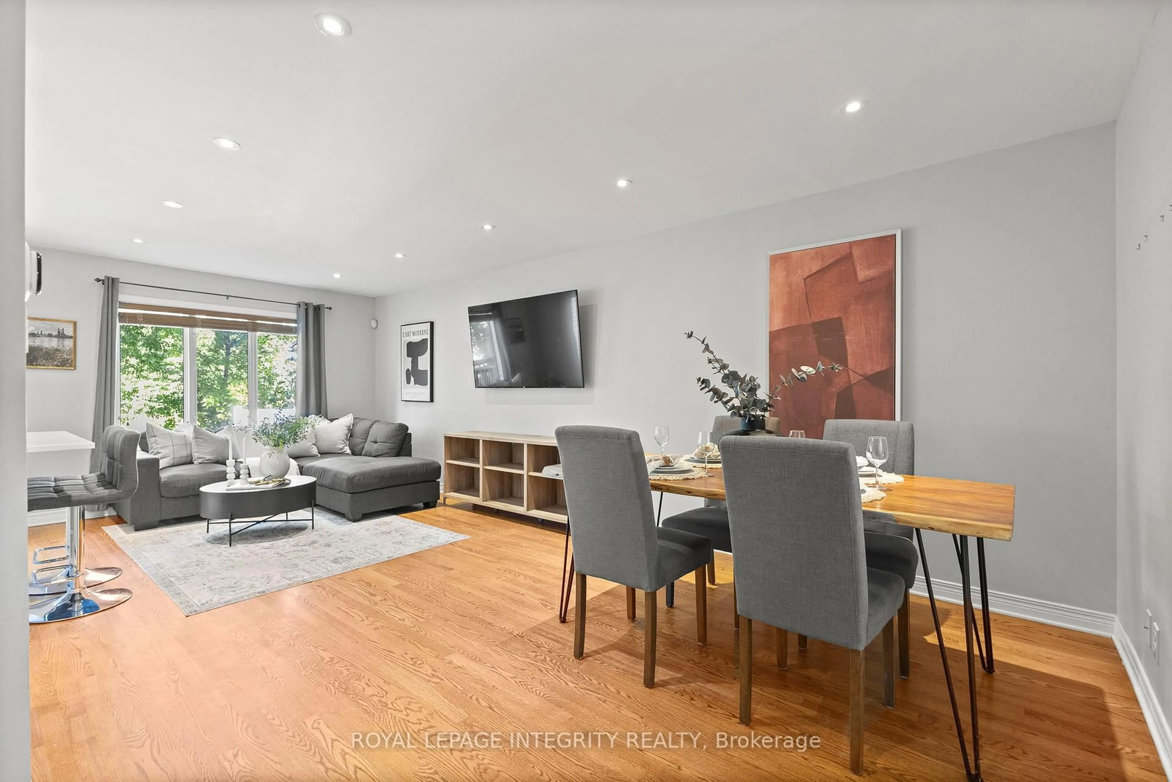 Living room with furniture, wood/laminate floor for 12 Sonata Pl, Ottawa Ontario K1G 6H2