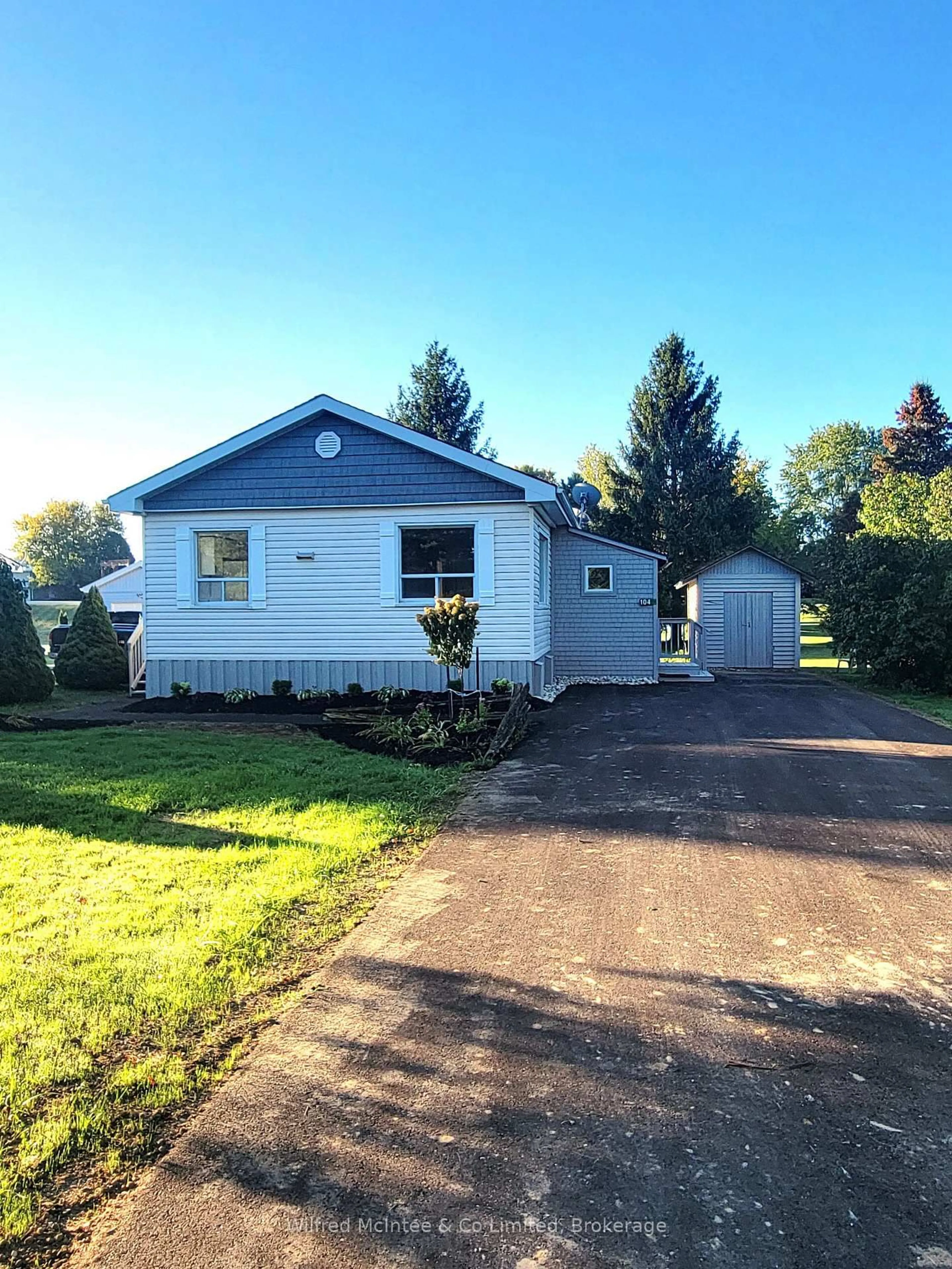 Home with vinyl exterior material, street for 104 MEADOWS Dr, West Grey Ontario N4N 3B8