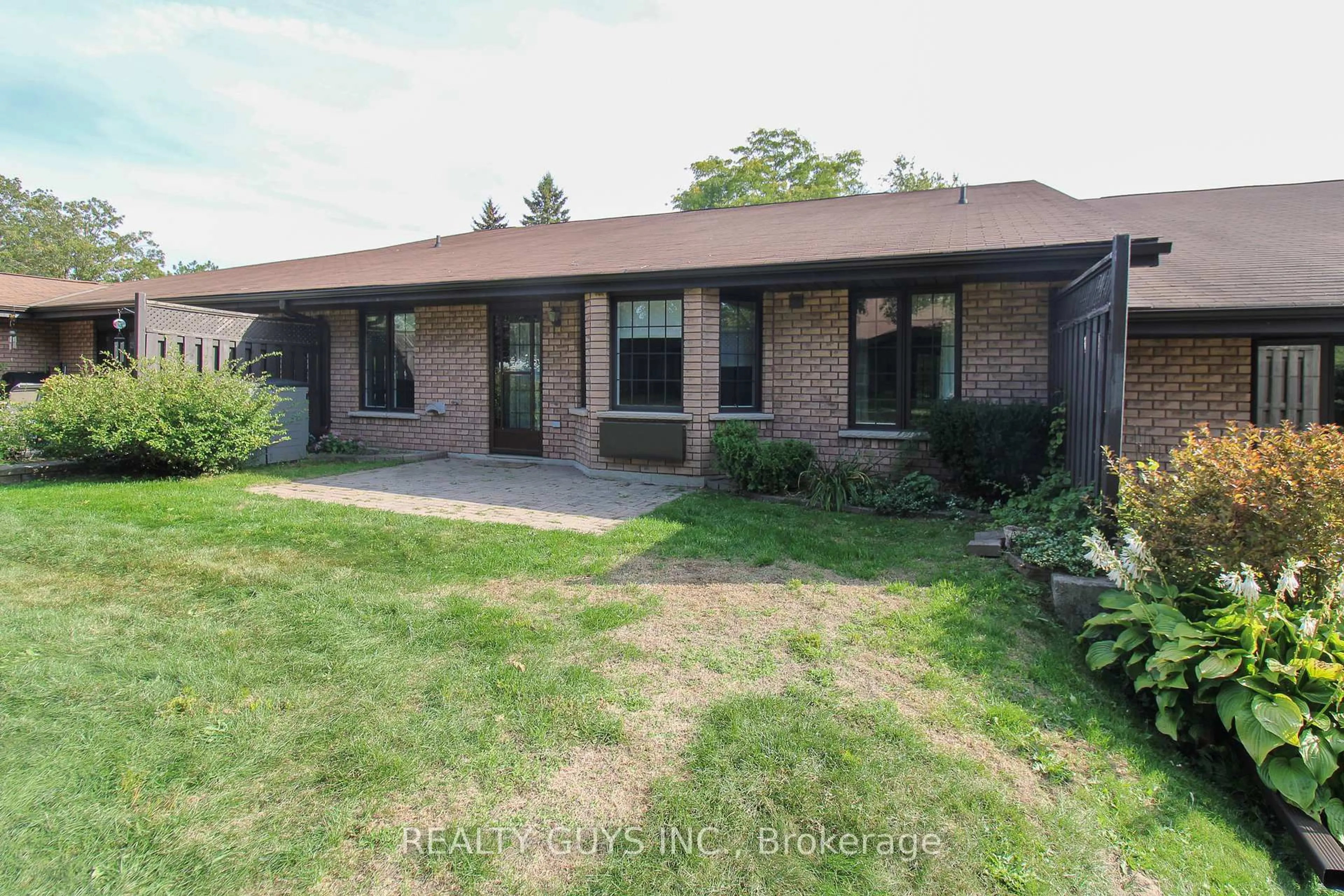 Home with brick exterior material, street for 693 Whitaker St #4, Peterborough Ontario K9H 7K3