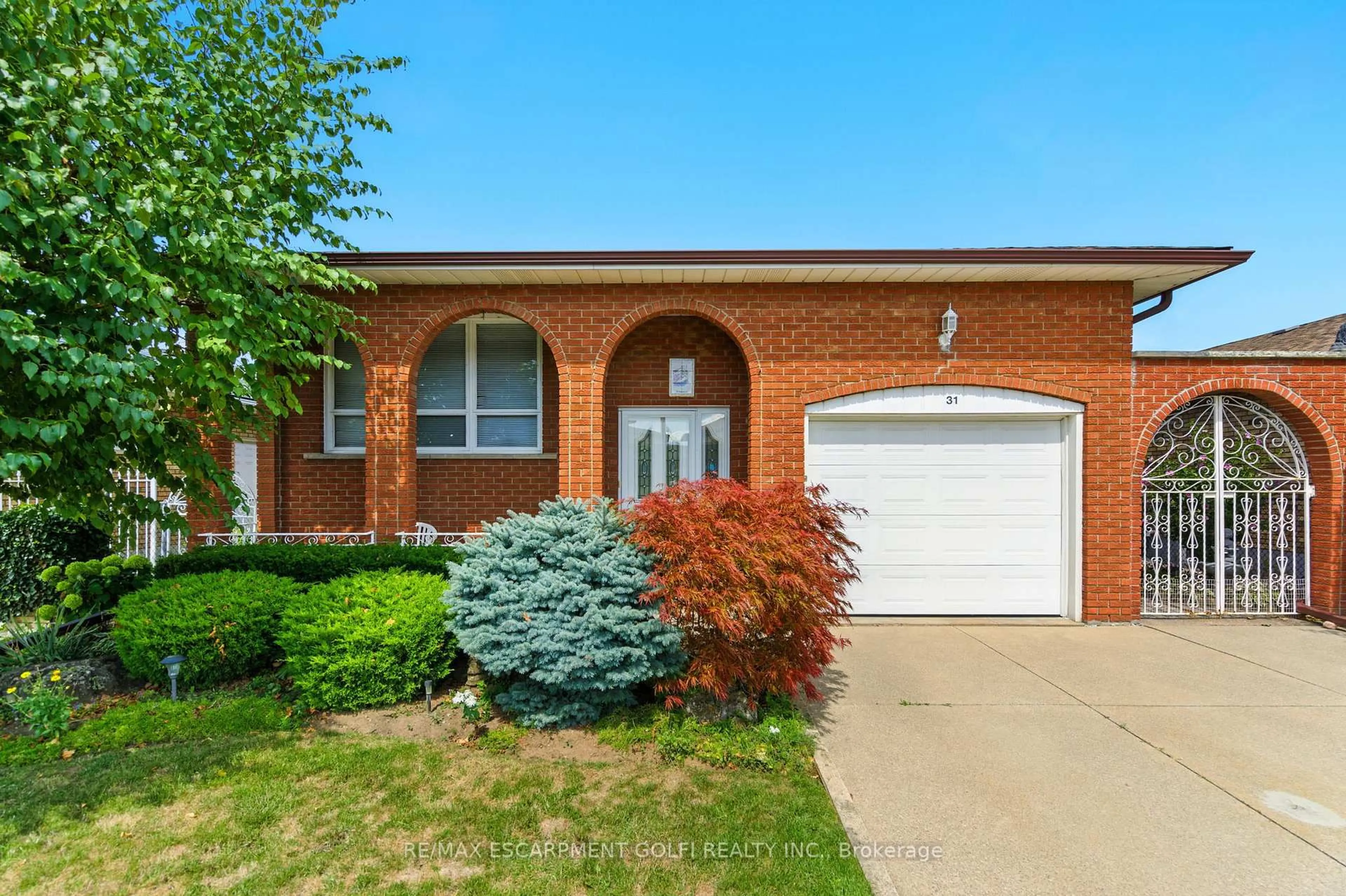 Home with brick exterior material, street for 31 Village Dr, Hamilton Ontario L8E 3M9