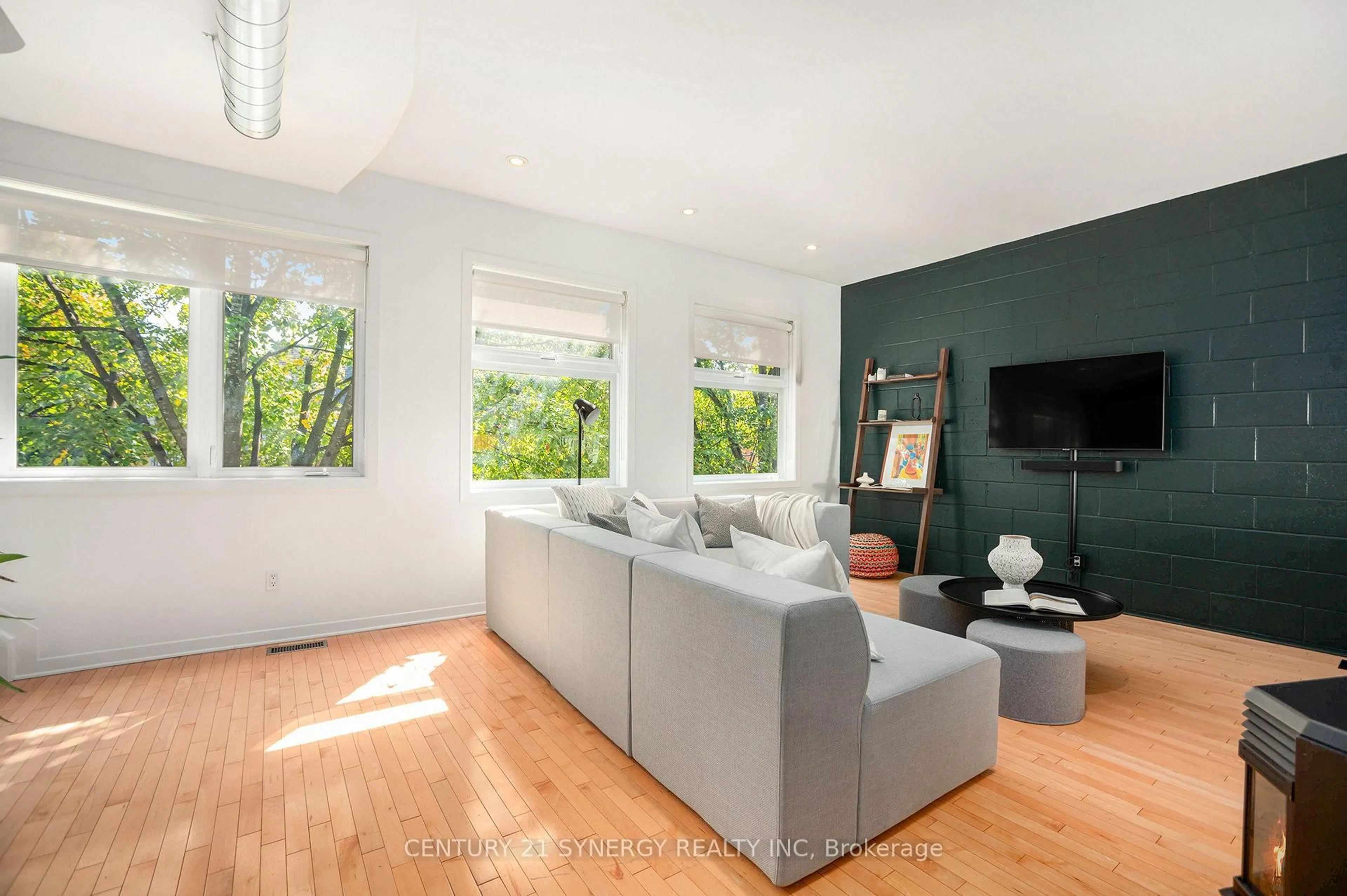 Living room with furniture, wood/laminate floor for 1137 Gladstone Ave, Ottawa Ontario K1Y 3H4