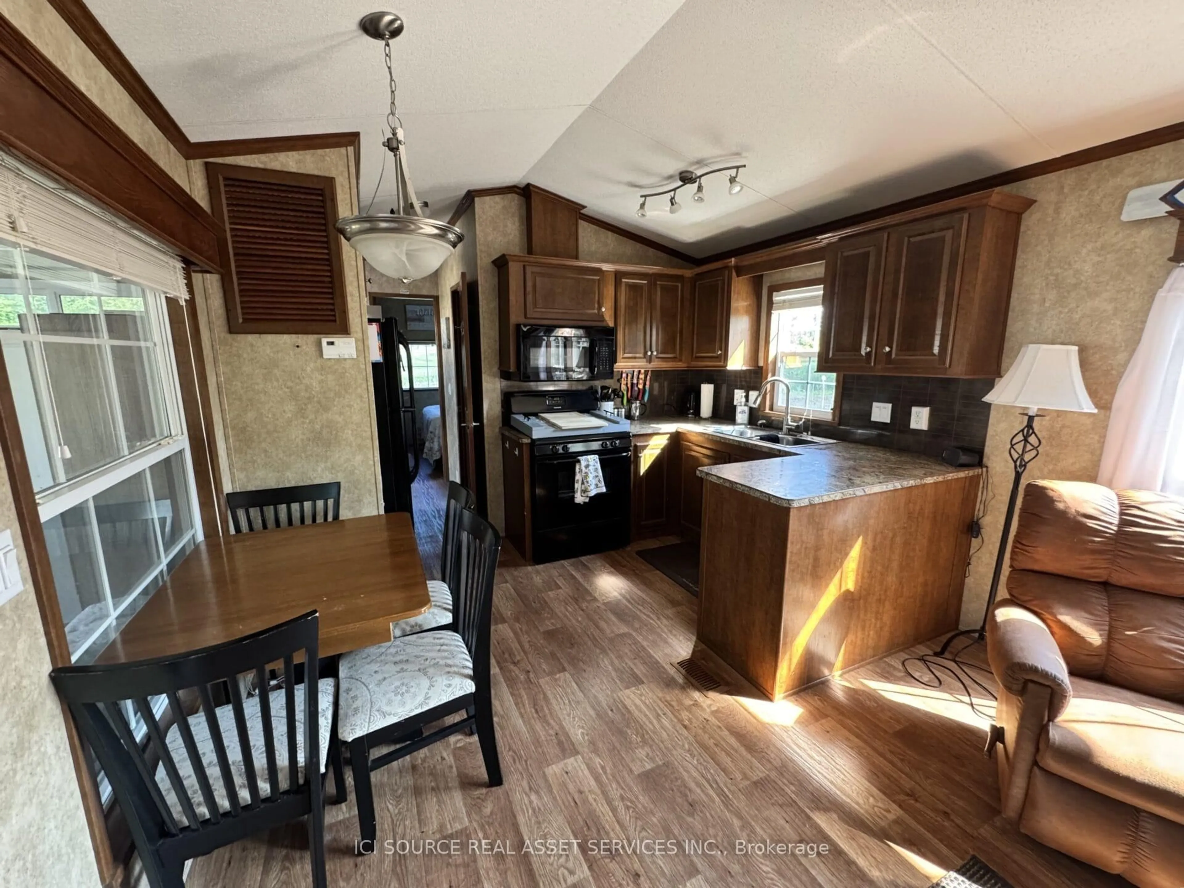 Open concept kitchen, wood/laminate floor for 1235 Villiers Line #GDF011, Otonabee-South Monaghan Ontario K0L 2G0