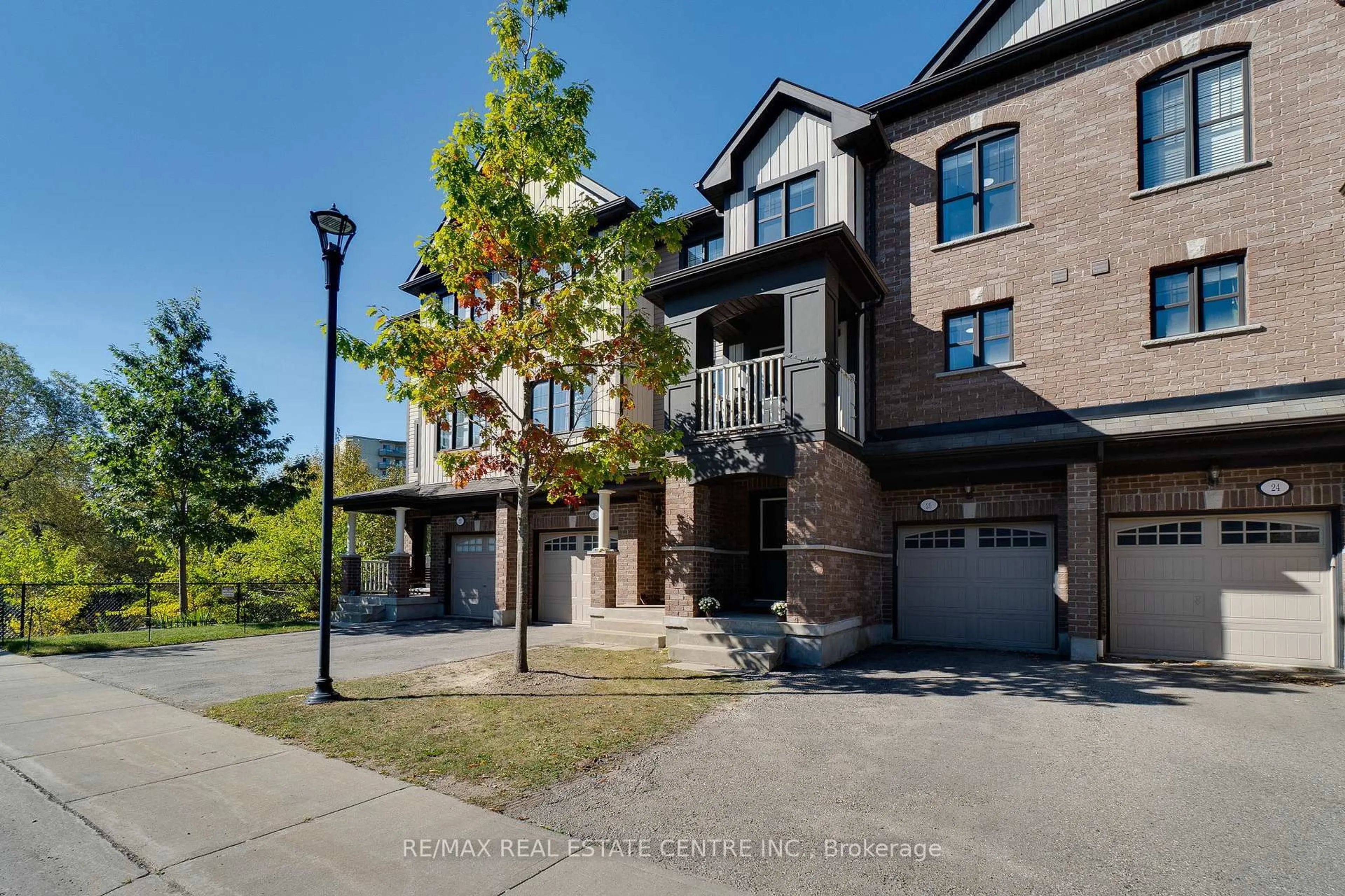 A pic from outside/outdoor area/front of a property/back of a property/a pic from drone, street for 701 Homer Watson Blvd #25, Kitchener Ontario N2C 0B5