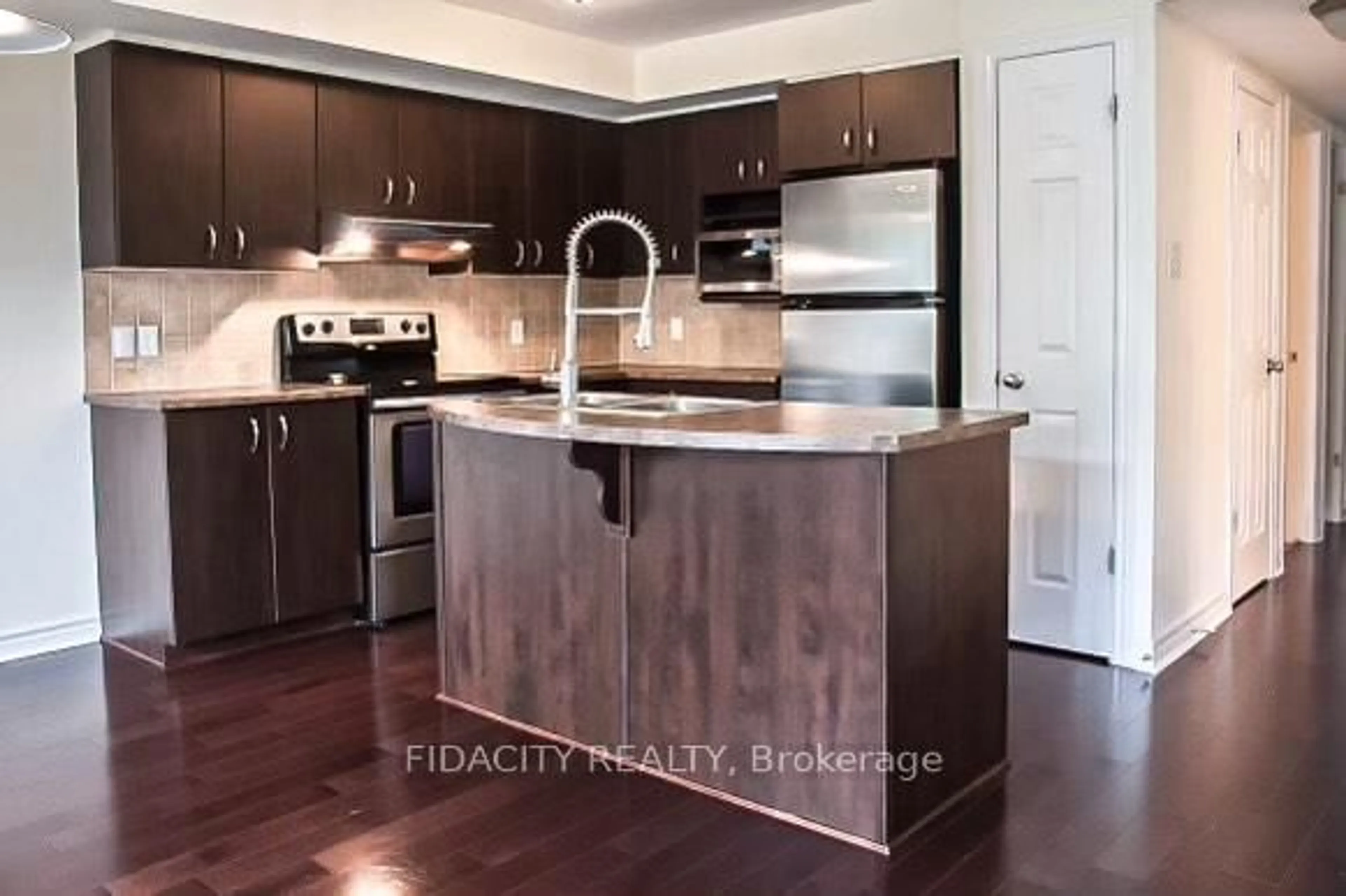 Open concept kitchen, wood/laminate floor for 525 Stonefield Private #2, Ottawa Ontario K2G 4R4