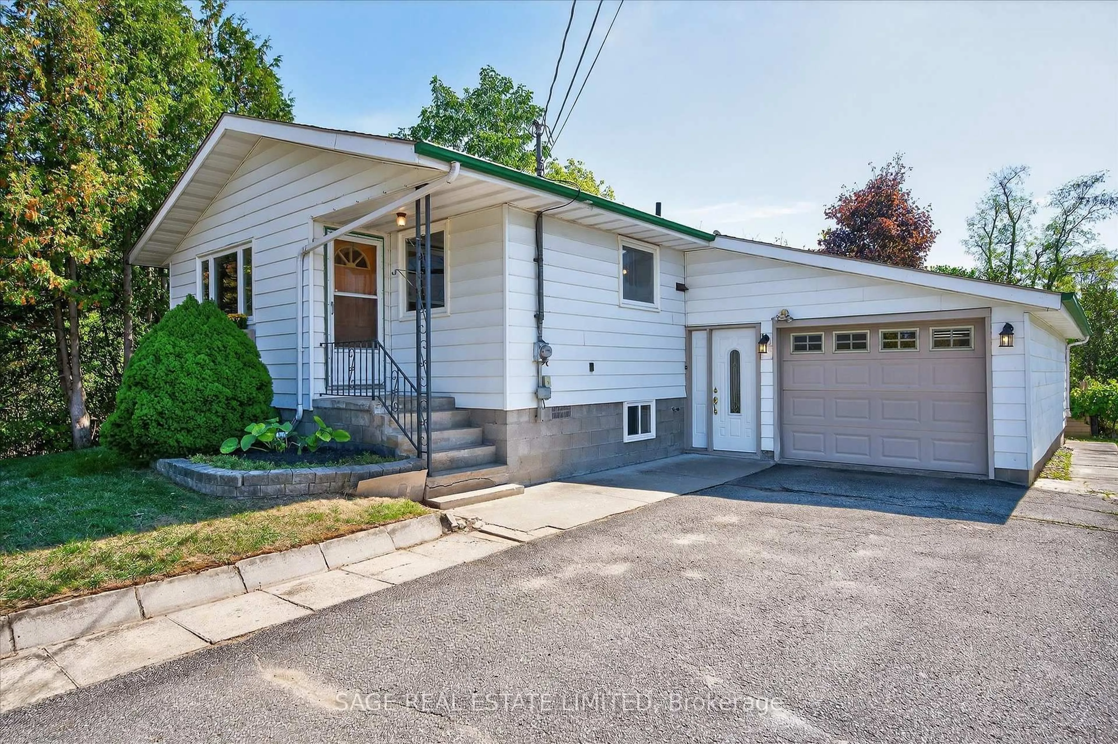 Home with vinyl exterior material, street for 48 Queen St, Kawartha Lakes Ontario K0M 1A0