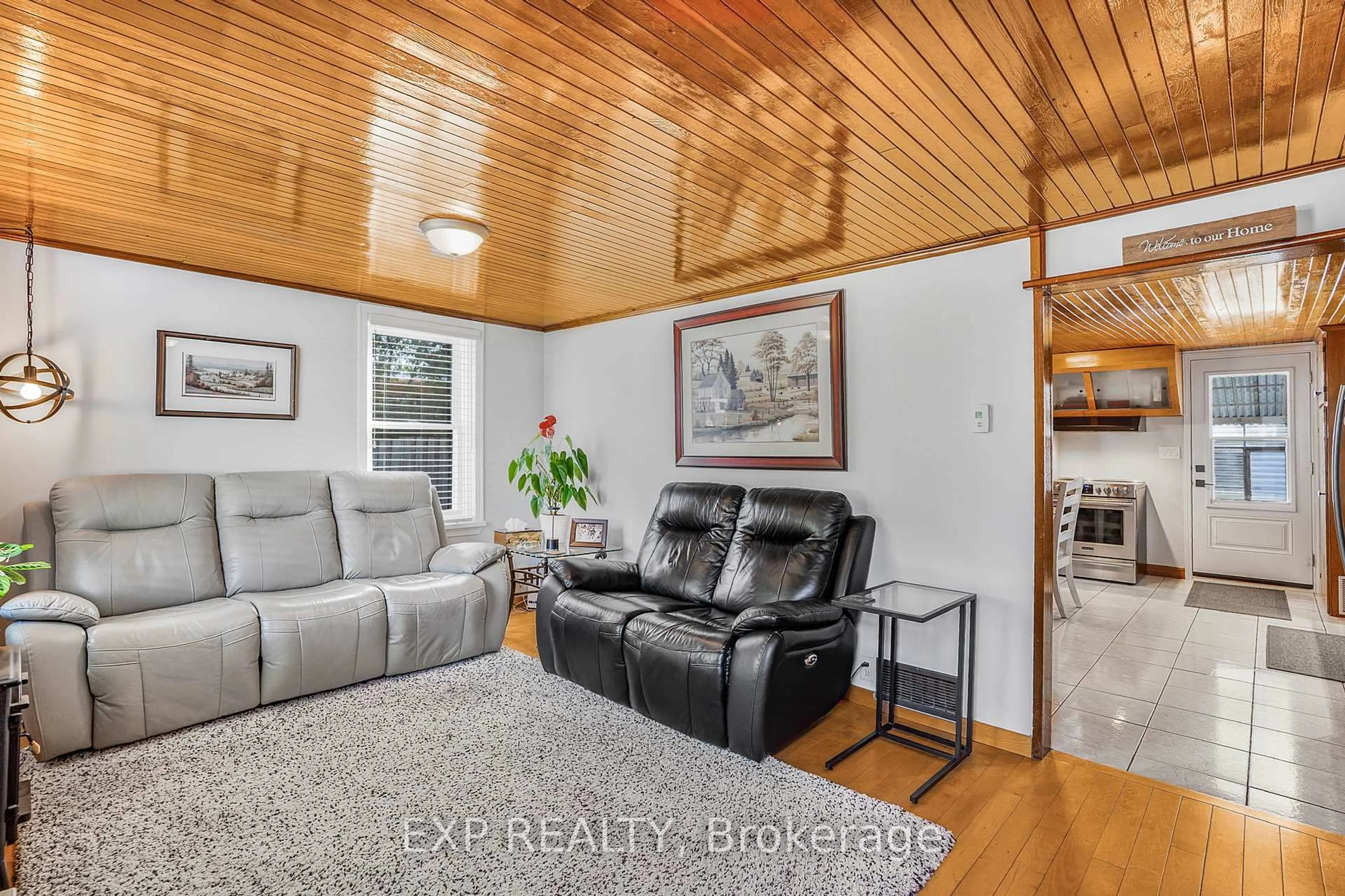 Living room with furniture, wood/laminate floor for 26 Alexander St, North Glengarry Ontario K0C 1T0