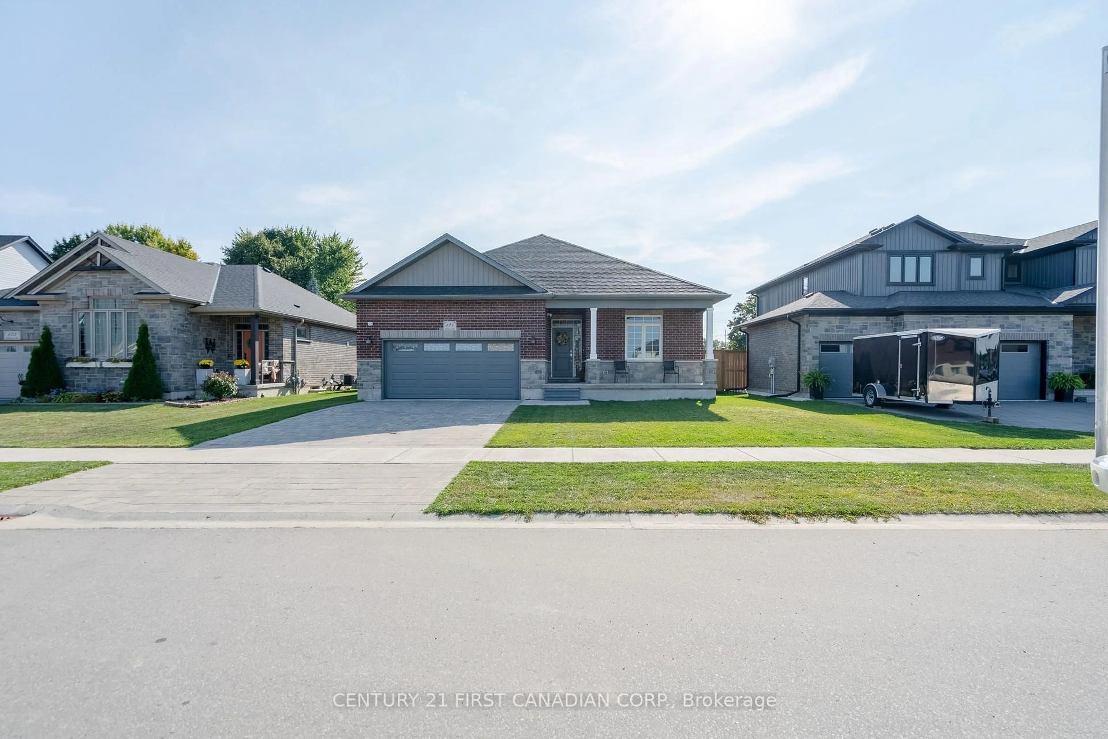 Home with brick exterior material, street for 125 SPENCER Ave, Lucan Biddulph Ontario N0M 2J0