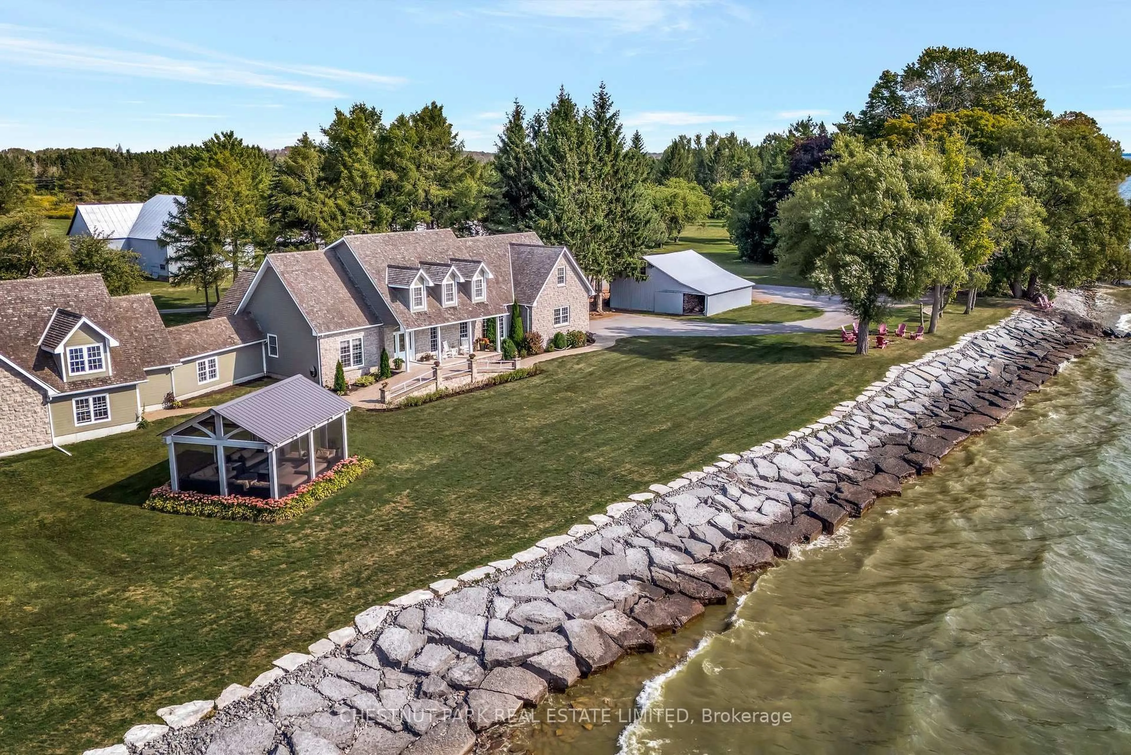 A pic from outside/outdoor area/front of a property/back of a property/a pic from drone, water/lake/river/ocean view for 4698 County Road 8, Prince Edward County Ontario K0K 2T0