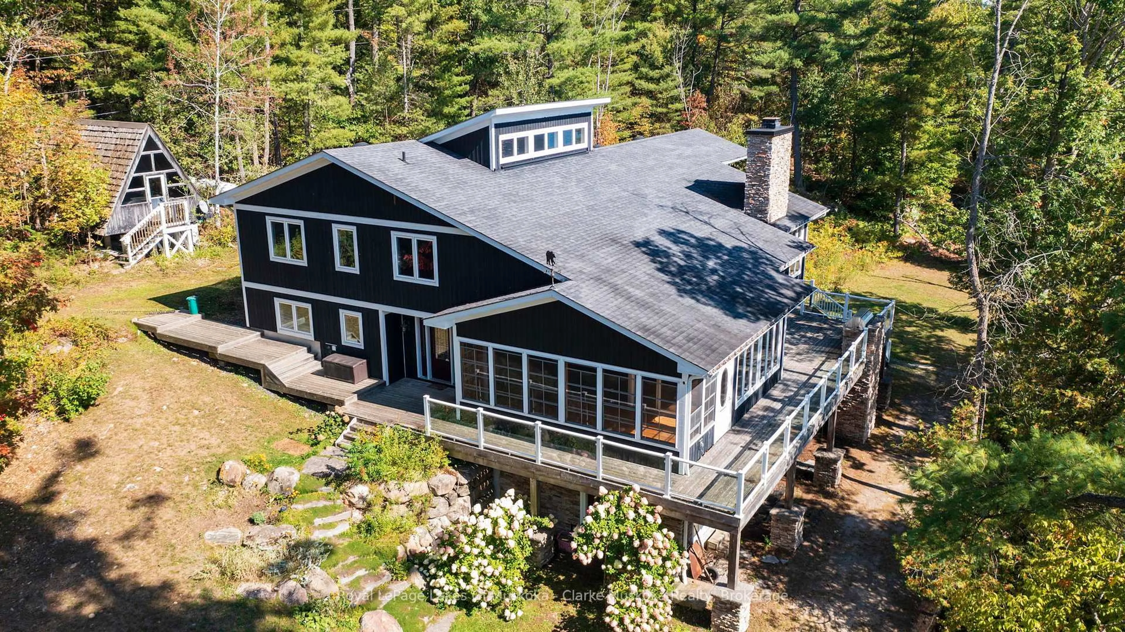 A pic from outside/outdoor area/front of a property/back of a property/a pic from drone, water/lake/river/ocean view for 1064 Road 3200, Gravenhurst Ontario P1P 1R2