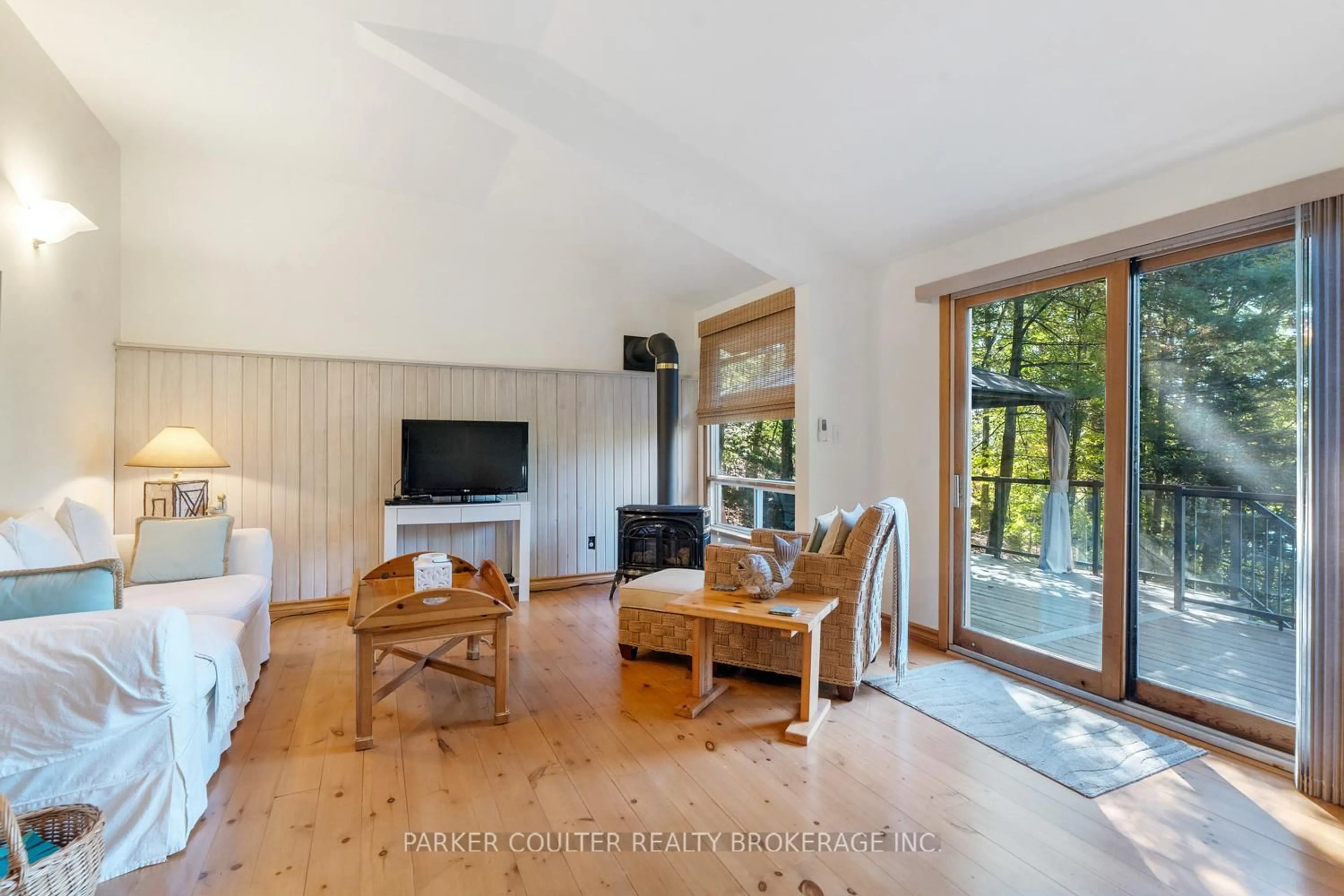 Living room with furniture, wood/laminate floor for 199 Sugar Lake Rd #A, Seguin Ontario P2A 2W9