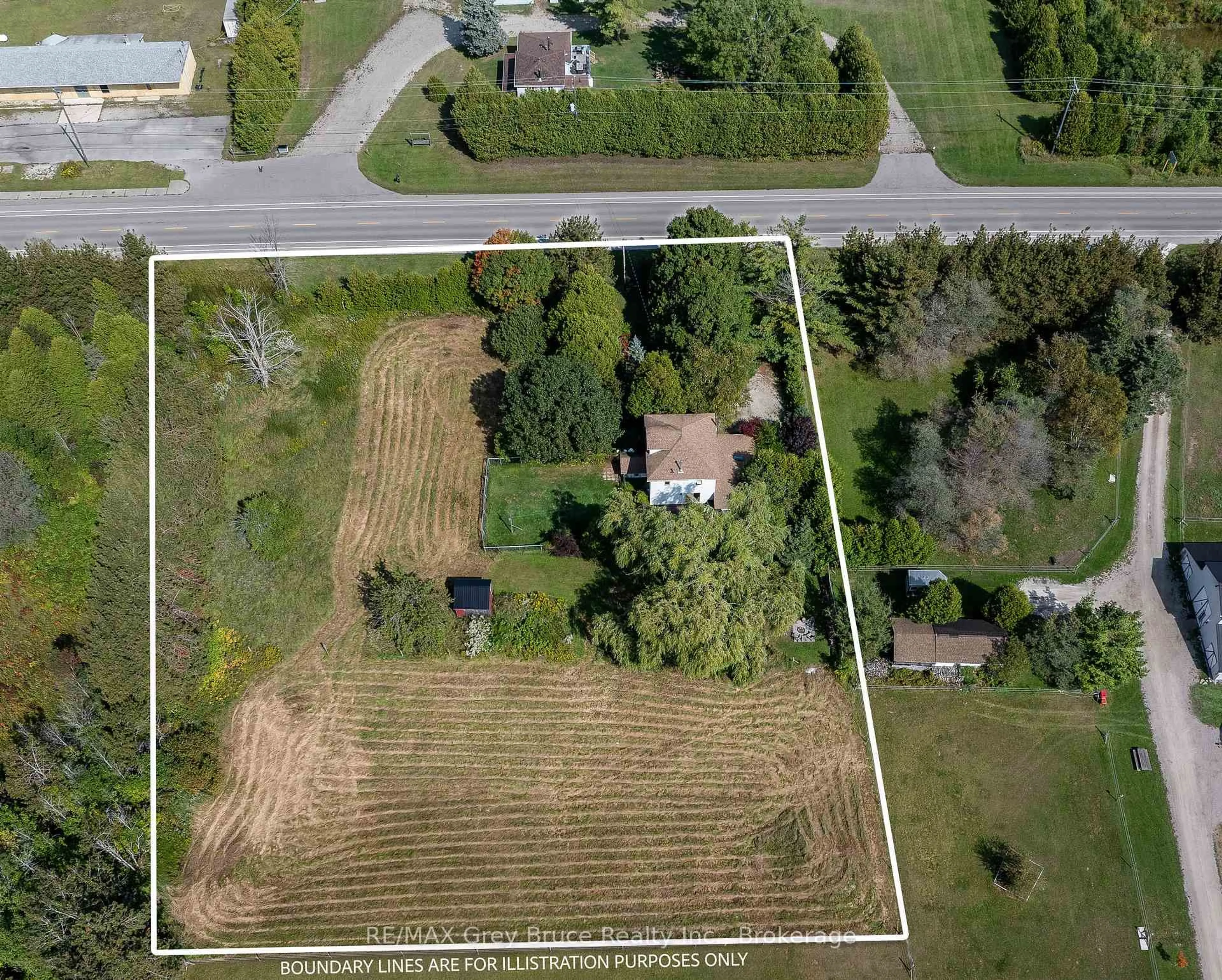 A pic from outside/outdoor area/front of a property/back of a property/a pic from drone, street for 7011 Highway 6, Northern Bruce Peninsula Ontario N0H 2R0