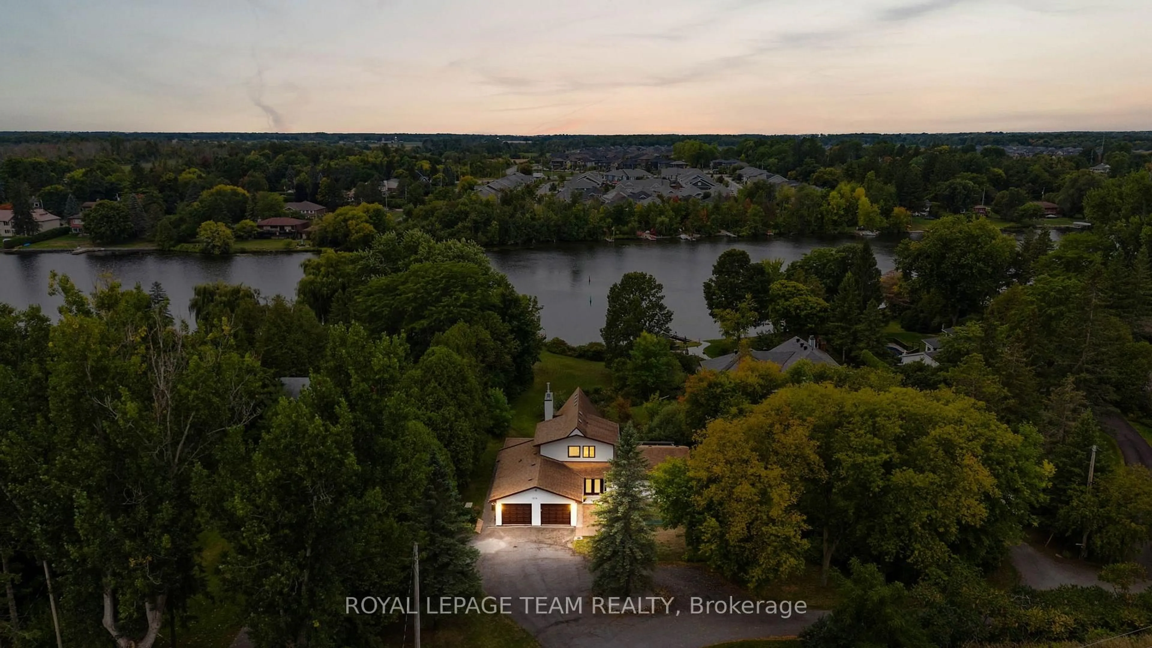 A pic from outside/outdoor area/front of a property/back of a property/a pic from drone, water/lake/river/ocean view for 1376 River Rd, Ottawa Ontario K4M 1B4