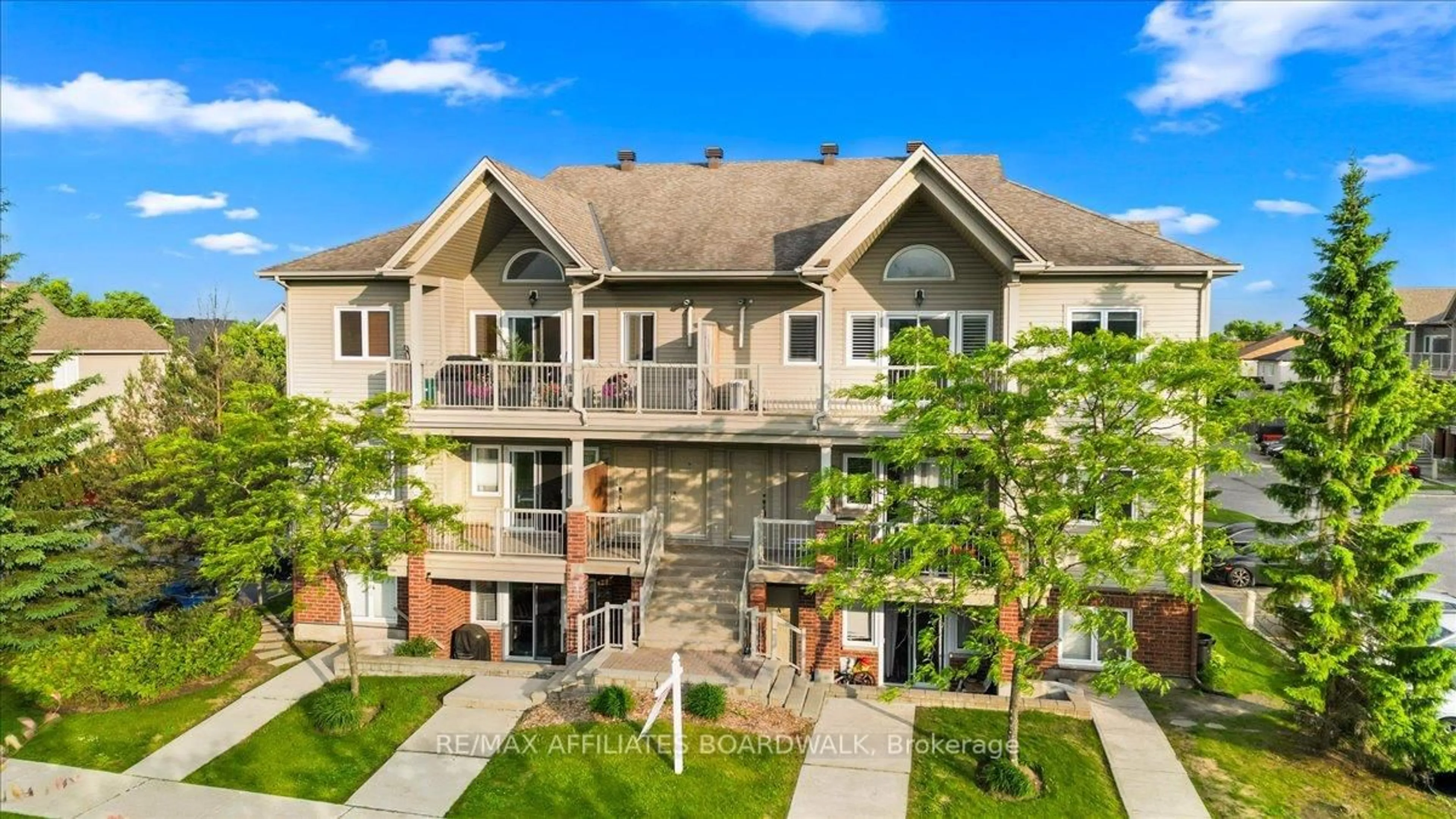 A pic from outside/outdoor area/front of a property/back of a property/a pic from drone, unknown for 241 Crestway Crescent Dr #I, Ottawa Ontario K2G 0A9