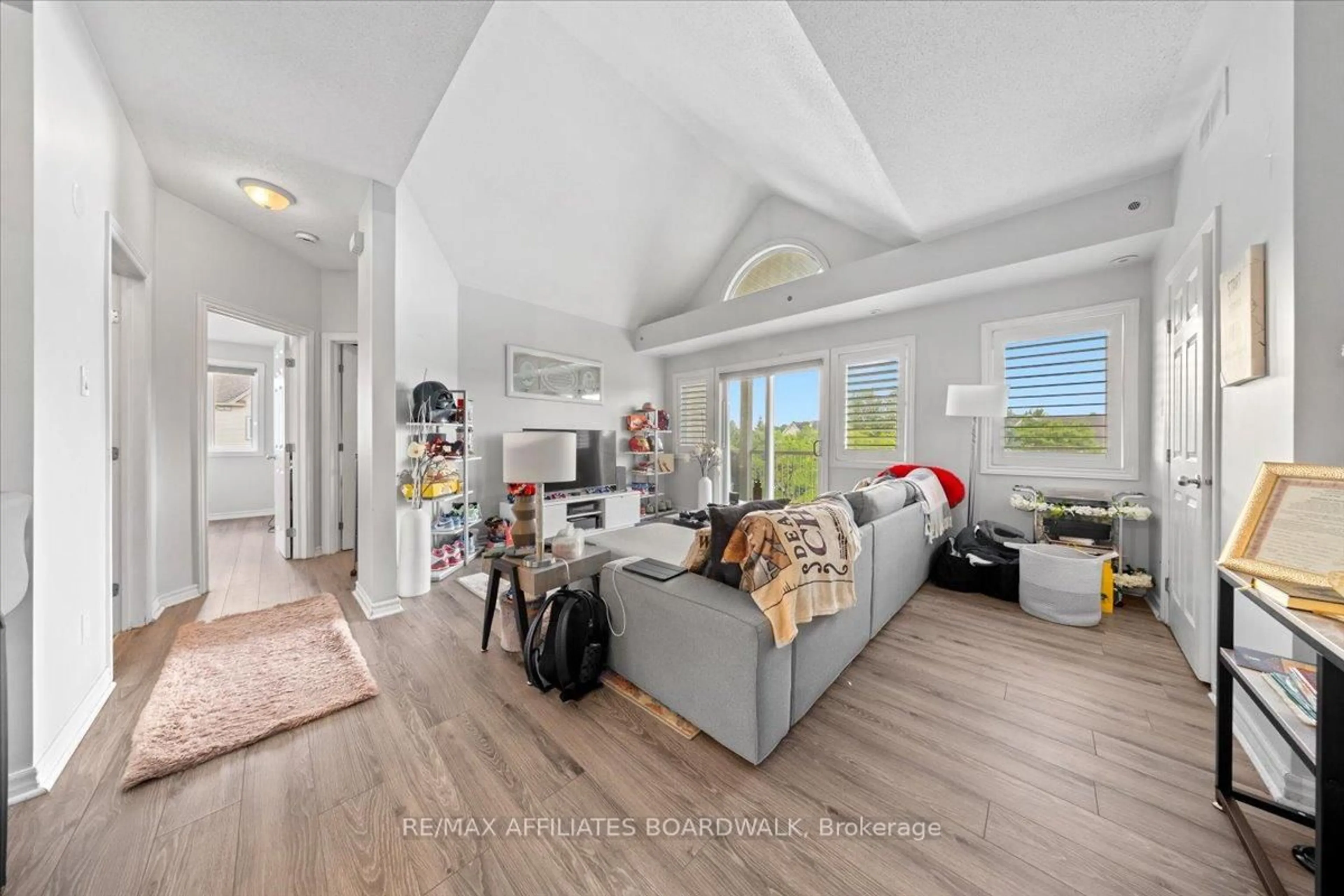 Living room with furniture, unknown for 241 Crestway Crescent Dr #I, Ottawa Ontario K2G 0A9