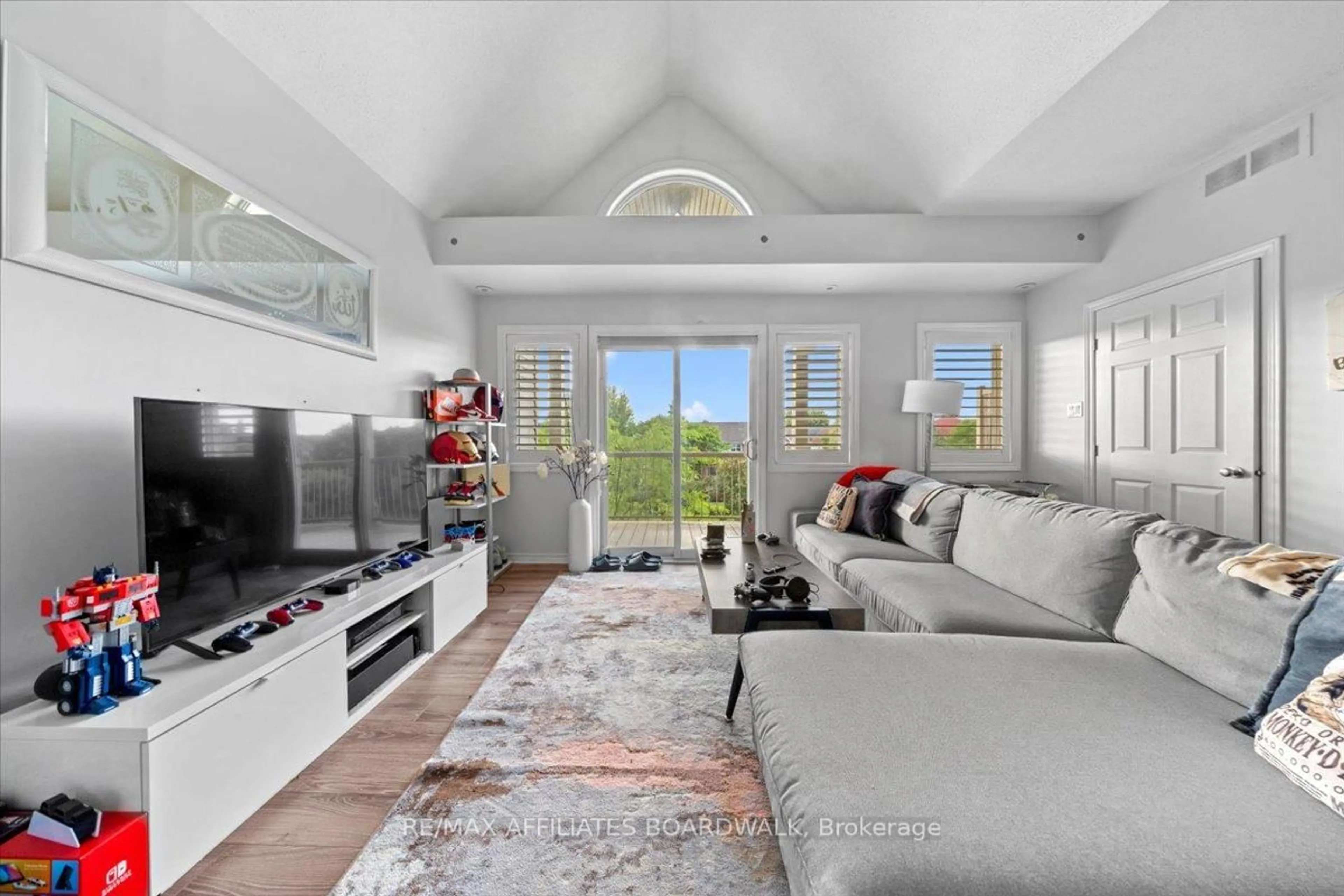 Living room with furniture, unknown for 241 Crestway Crescent Dr #I, Ottawa Ontario K2G 0A9