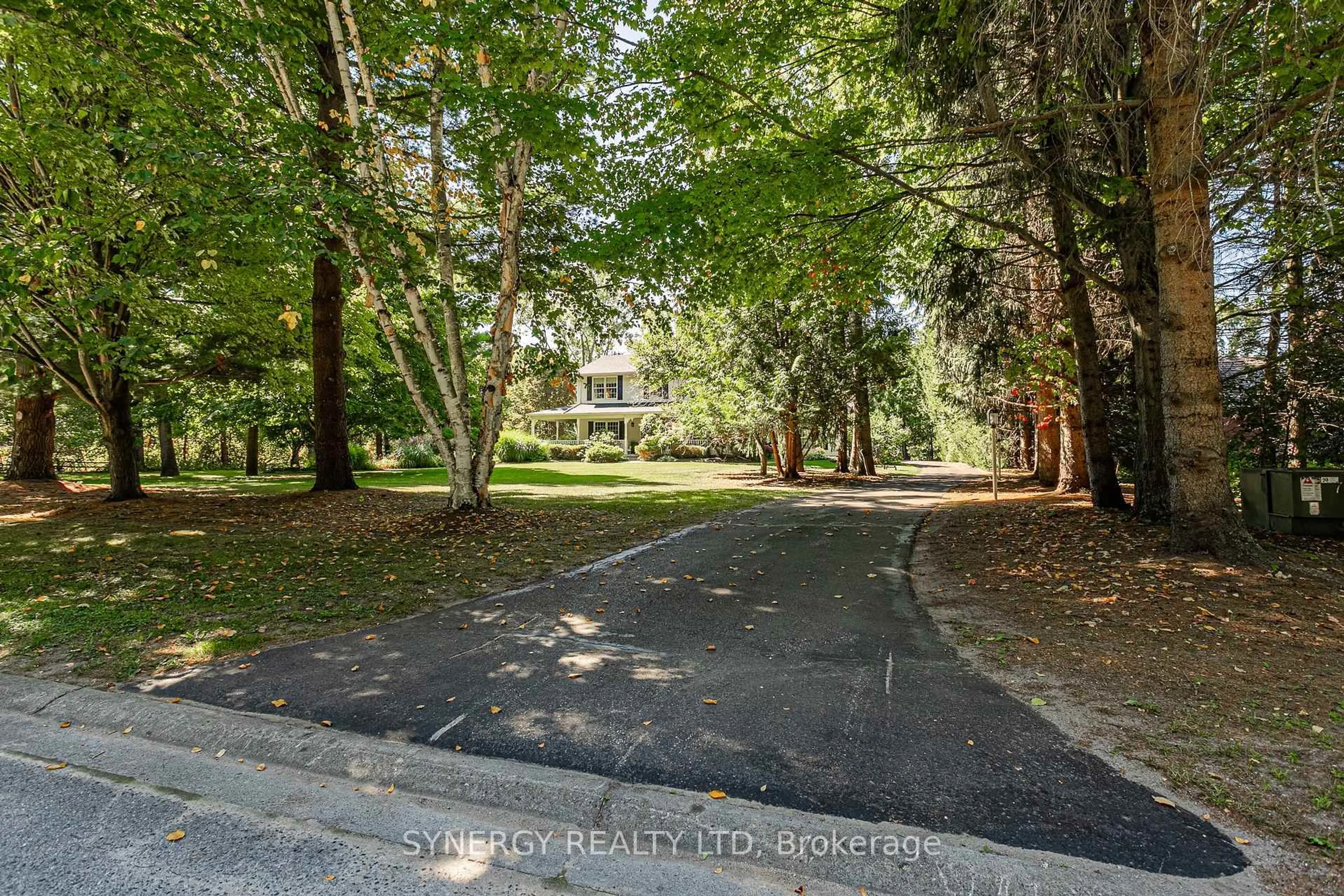 A pic from outside/outdoor area/front of a property/back of a property/a pic from drone, forest/trees view for 1 lansdowne park Cres, Middlesex Centre Ontario N0L 1R0