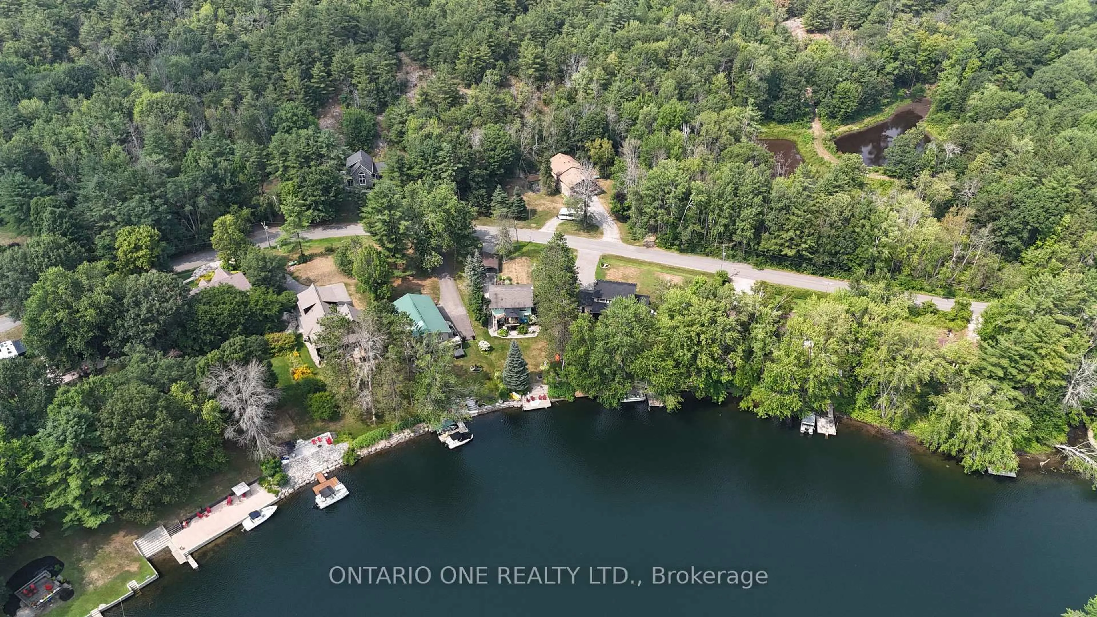 A pic from outside/outdoor area/front of a property/back of a property/a pic from drone, water/lake/river/ocean view for 1045 Cowbell Lane, Gravenhurst Ontario P0E 1N0