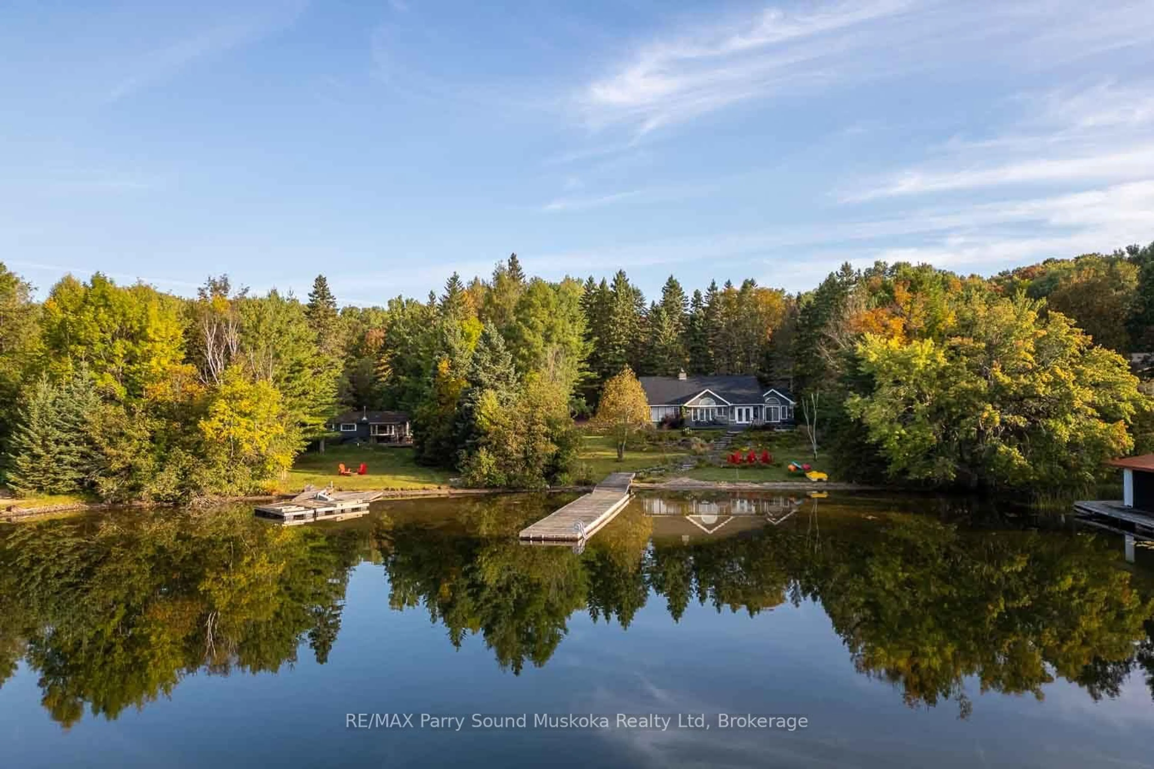 A pic from outside/outdoor area/front of a property/back of a property/a pic from drone, water/lake/river/ocean view for 1075 Sawmill Lane, Lake of Bays Ontario P1H 2J6