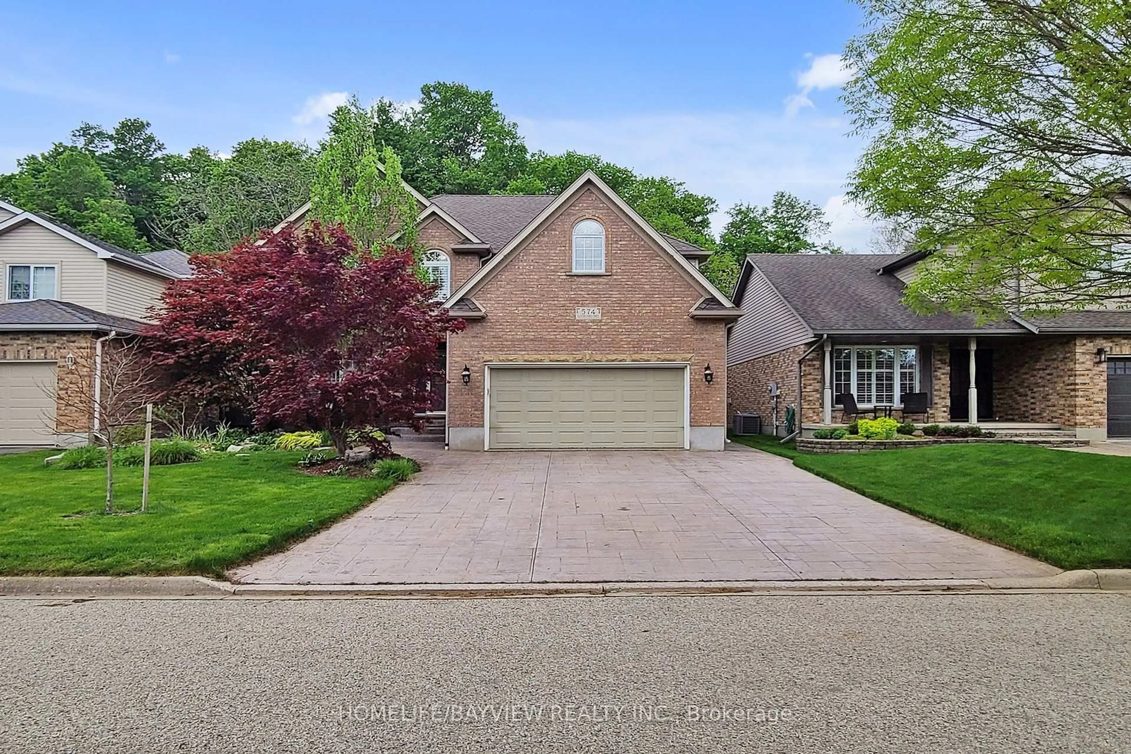 Home with brick exterior material, street for 574 Sandbanks Cres, Waterloo Ontario N2V 2K2