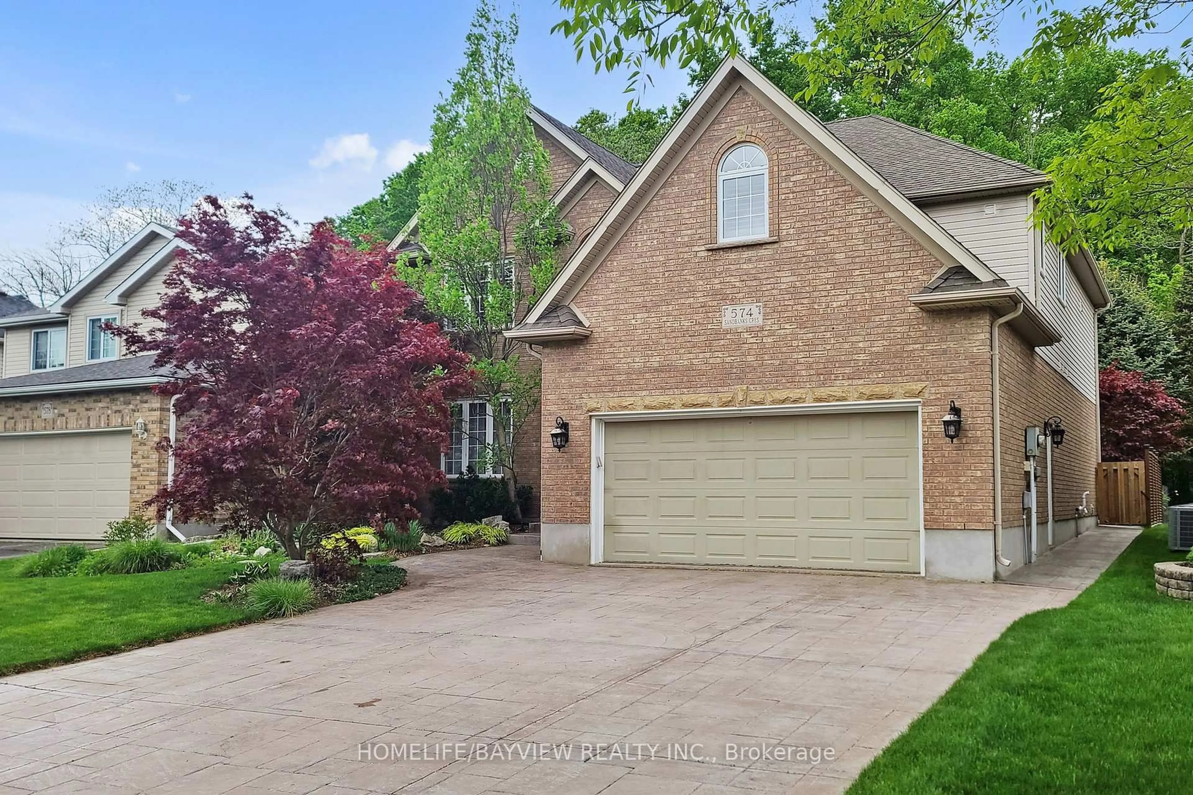 Home with brick exterior material, street for 574 Sandbanks Cres, Waterloo Ontario N2V 2K2