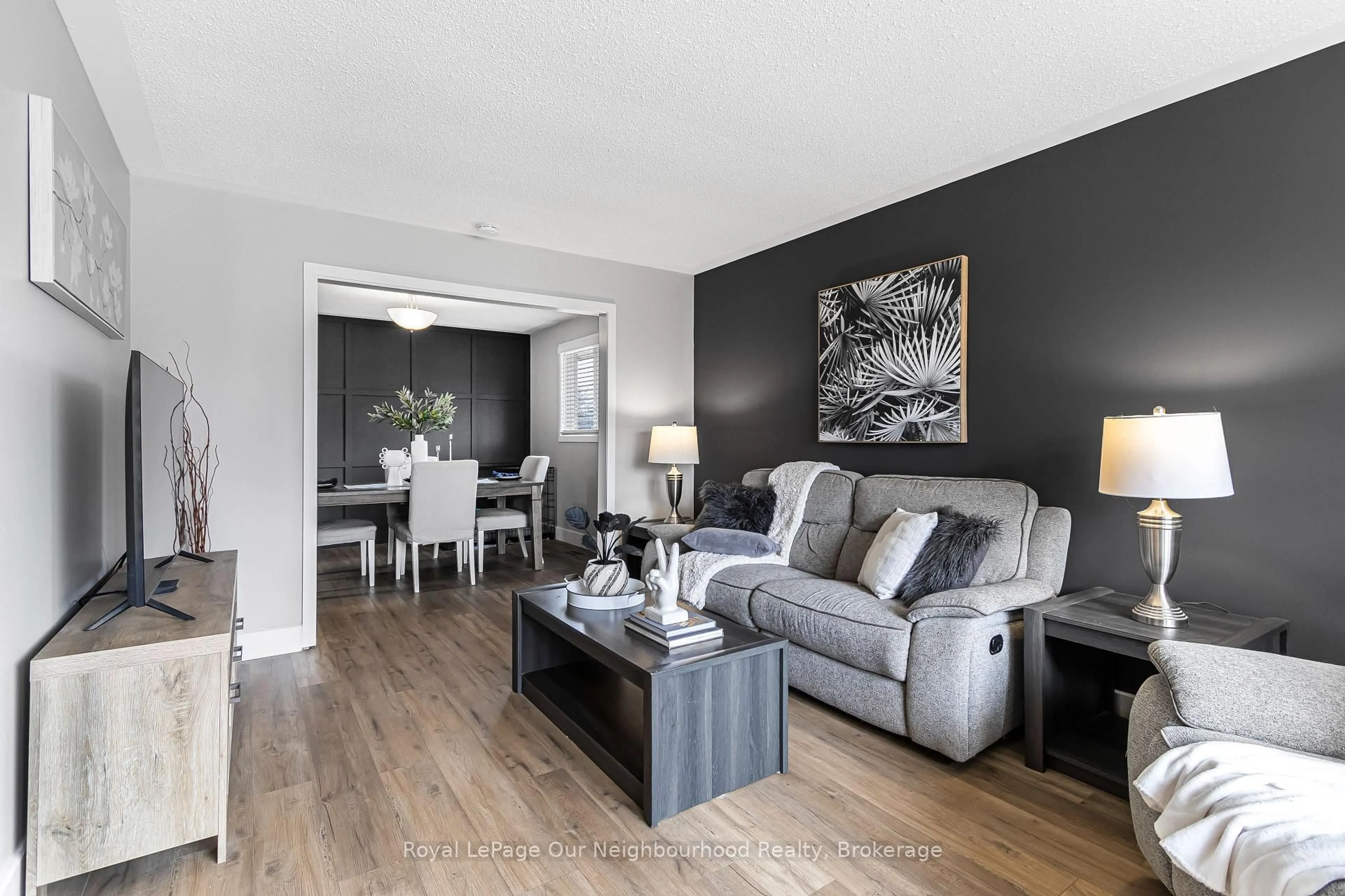 Living room with furniture, wood/laminate floor for 2 Woodfern Rd, London East Ontario N5W 5X7