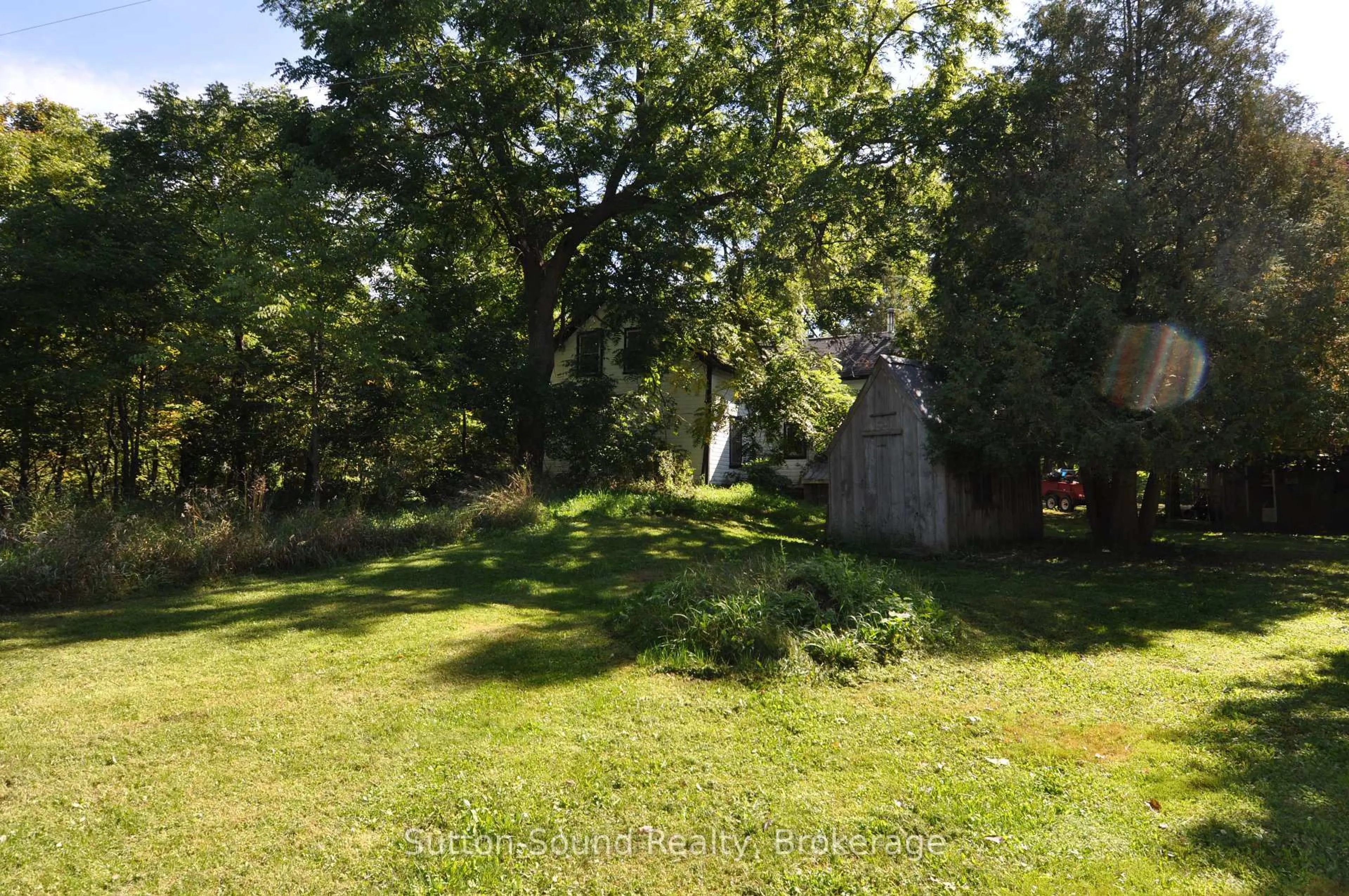 A pic from outside/outdoor area/front of a property/back of a property/a pic from drone, forest/trees view for 750816 Girl Guide Rd, Georgian Bluffs Ontario N4K 5N7