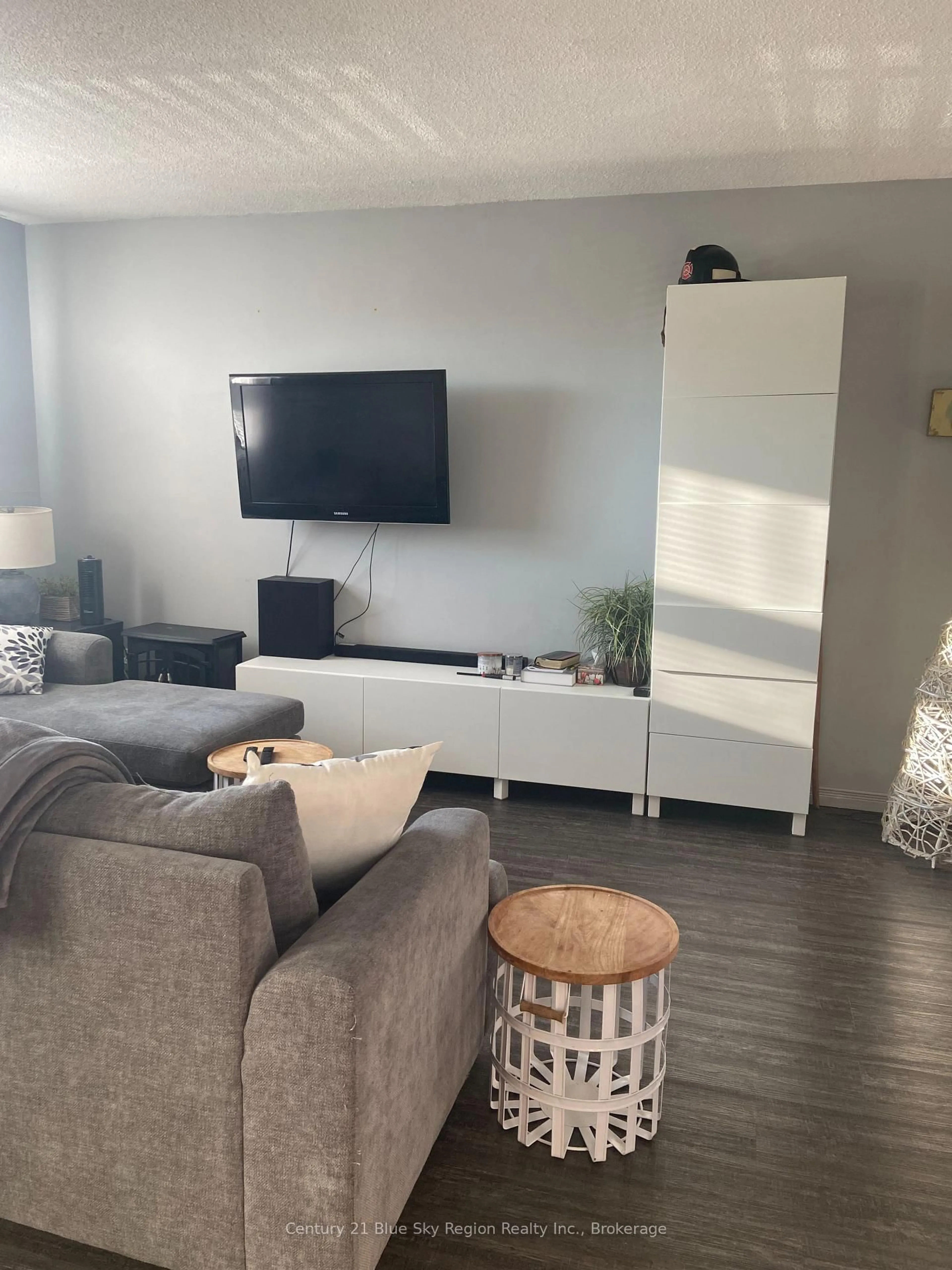 Living room with furniture, wood/laminate floor for 330 Sixth Ave #109, North Bay Ontario P1B 9G1