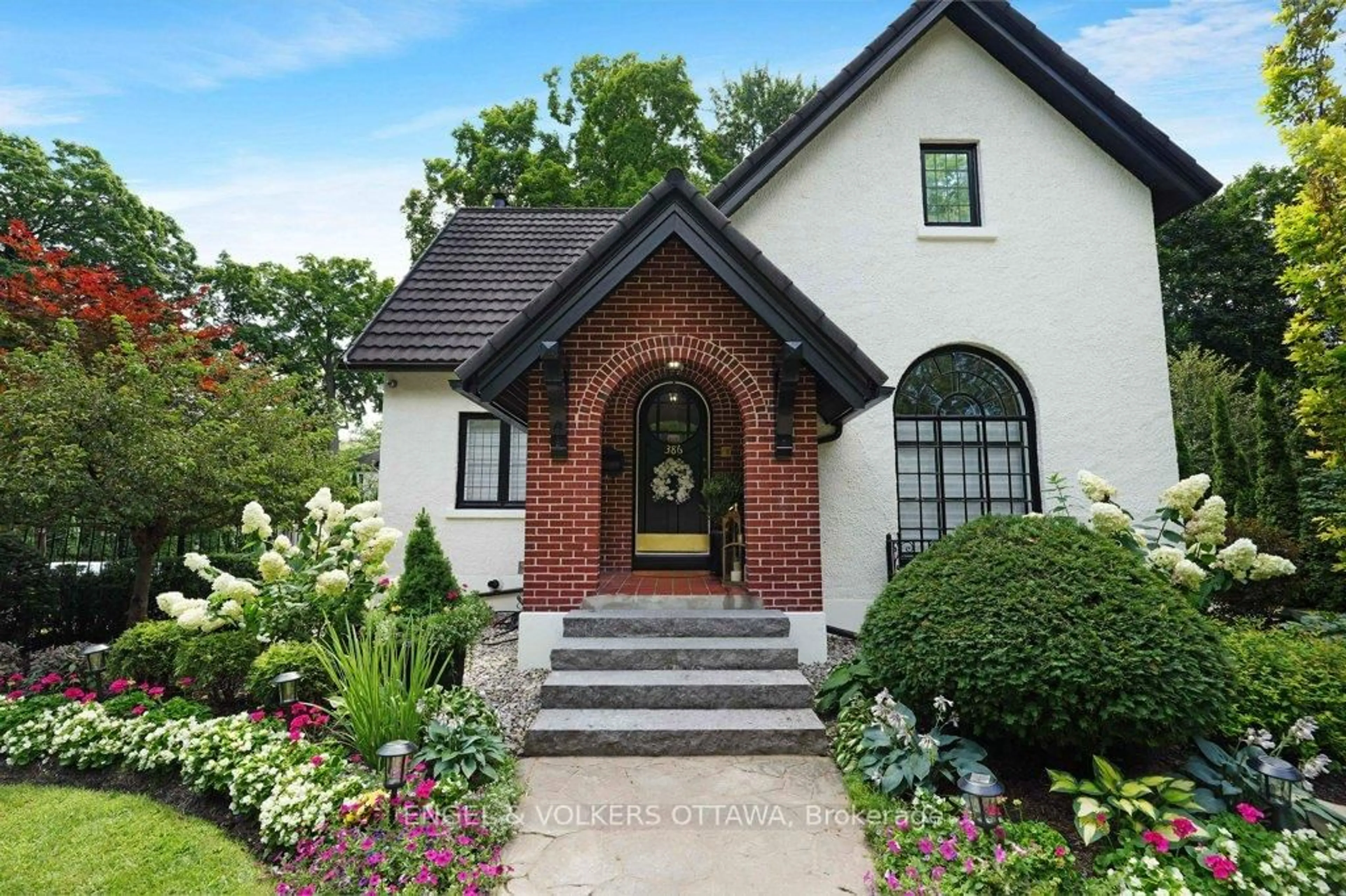 Home with brick exterior material, street for 386 Ashbury Rd, Ottawa Ontario K1M 0R8