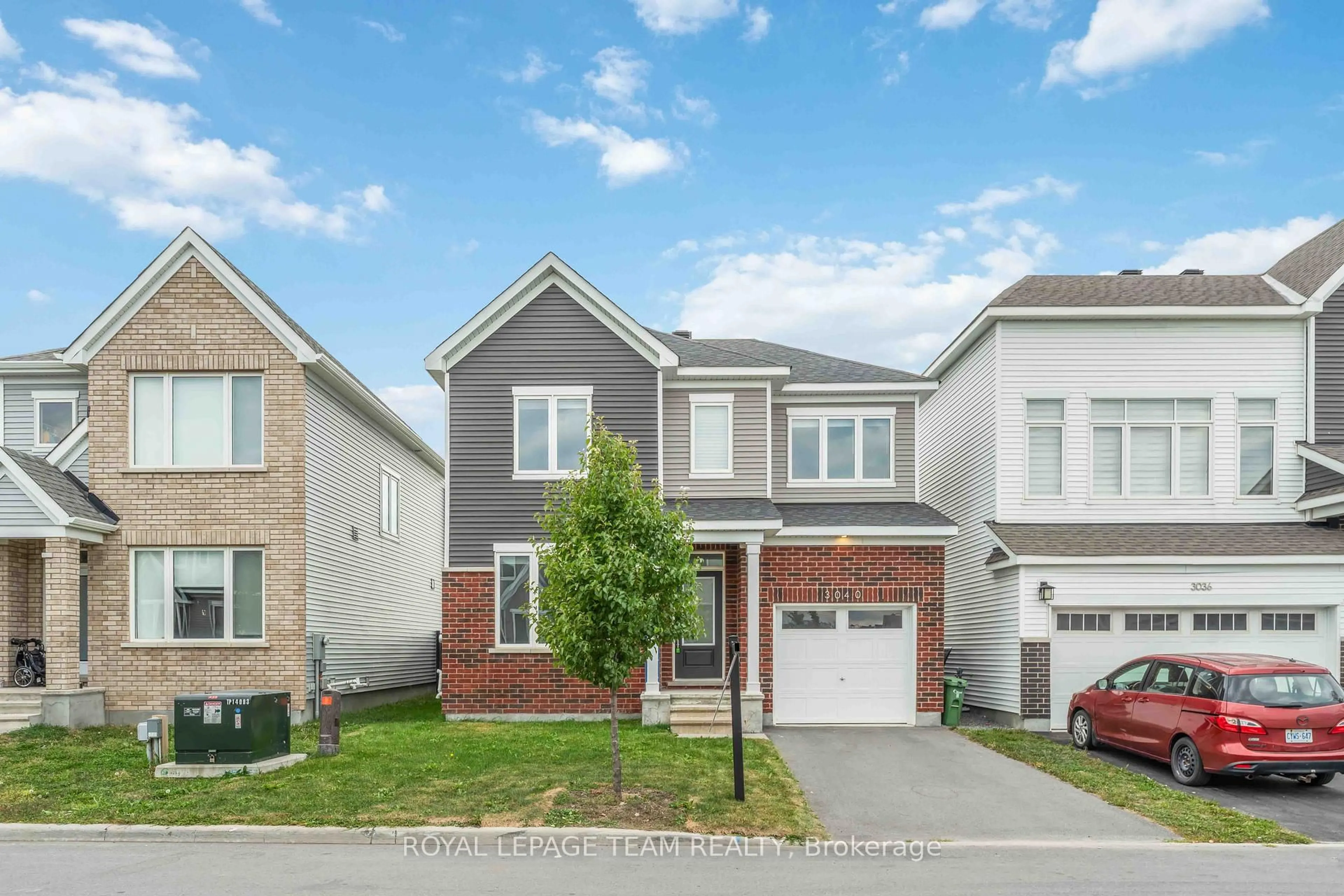 Home with brick exterior material, street for 3040 Travertine Way, Ottawa Ontario K2J 6W9