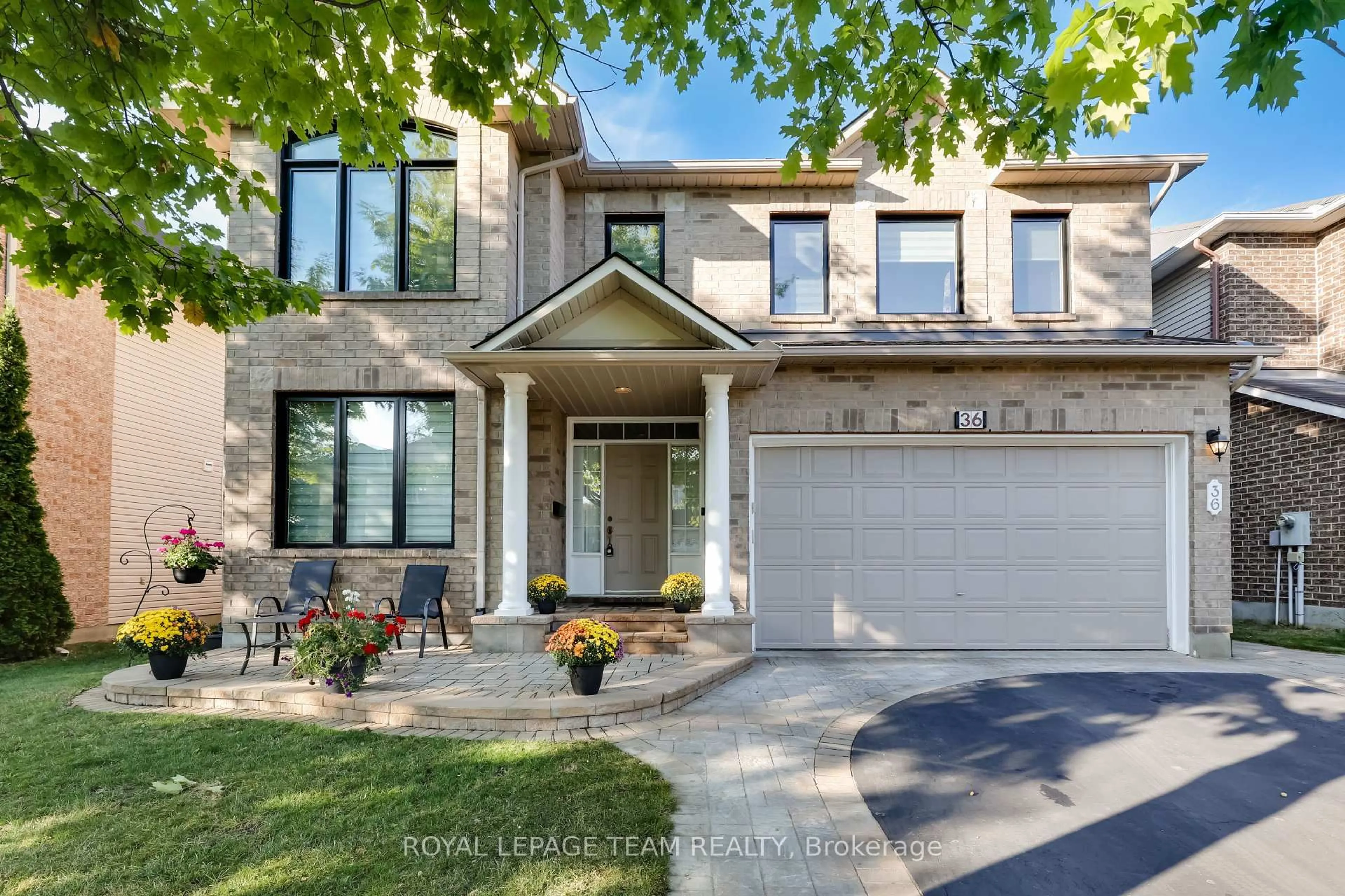 Home with brick exterior material, street for 36 Keighley Circ, Ottawa Ontario K2K 3H8