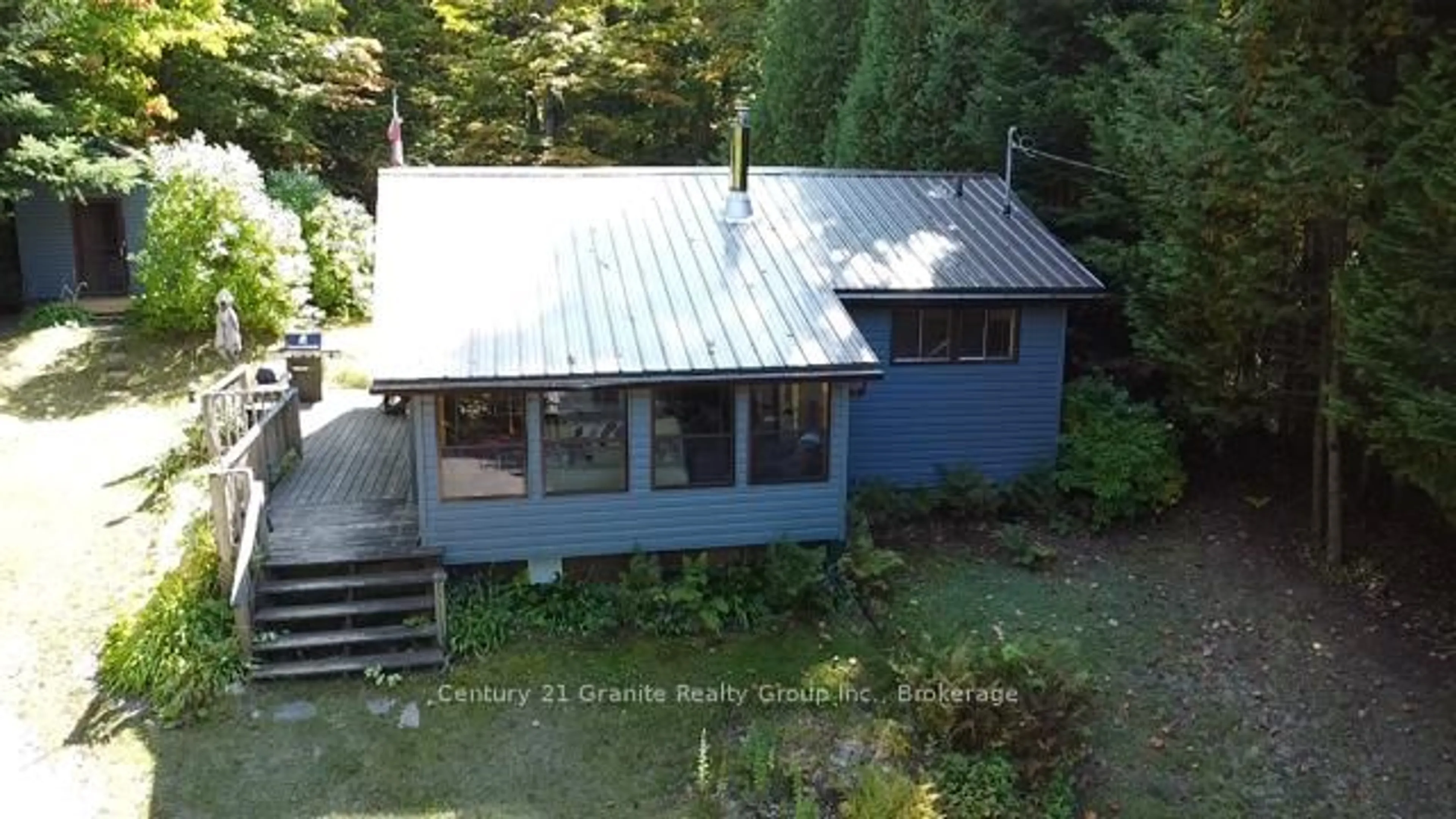 A pic from outside/outdoor area/front of a property/back of a property/a pic from drone, water/lake/river/ocean view for 1052 Kensington Rd, Dysart et al Ontario K0M 1S0