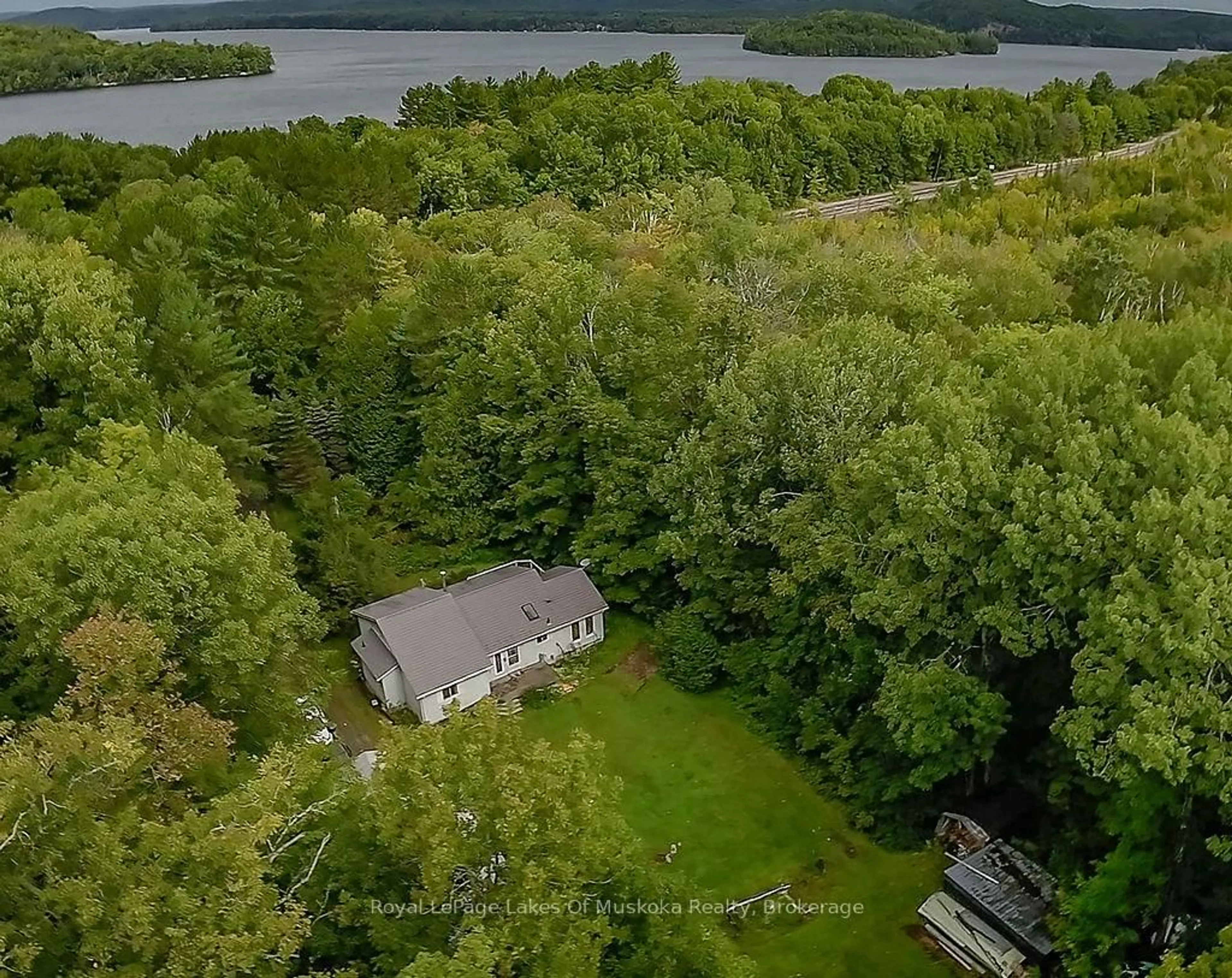 A pic from outside/outdoor area/front of a property/back of a property/a pic from drone, water/lake/river/ocean view for 4244 MUSKOKA ROAD 117, Lake of Bays Ontario P0B 1A0