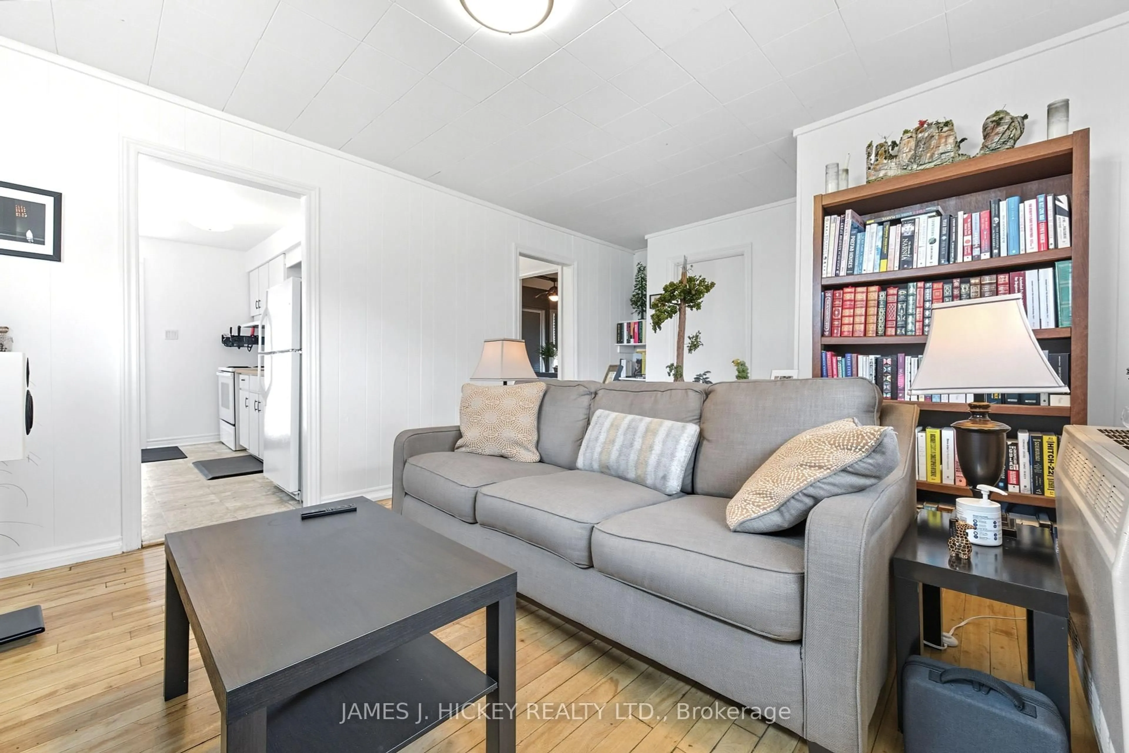 Living room with furniture, wood/laminate floor for 27 Summit St, Deep River Ontario K0J 1P0