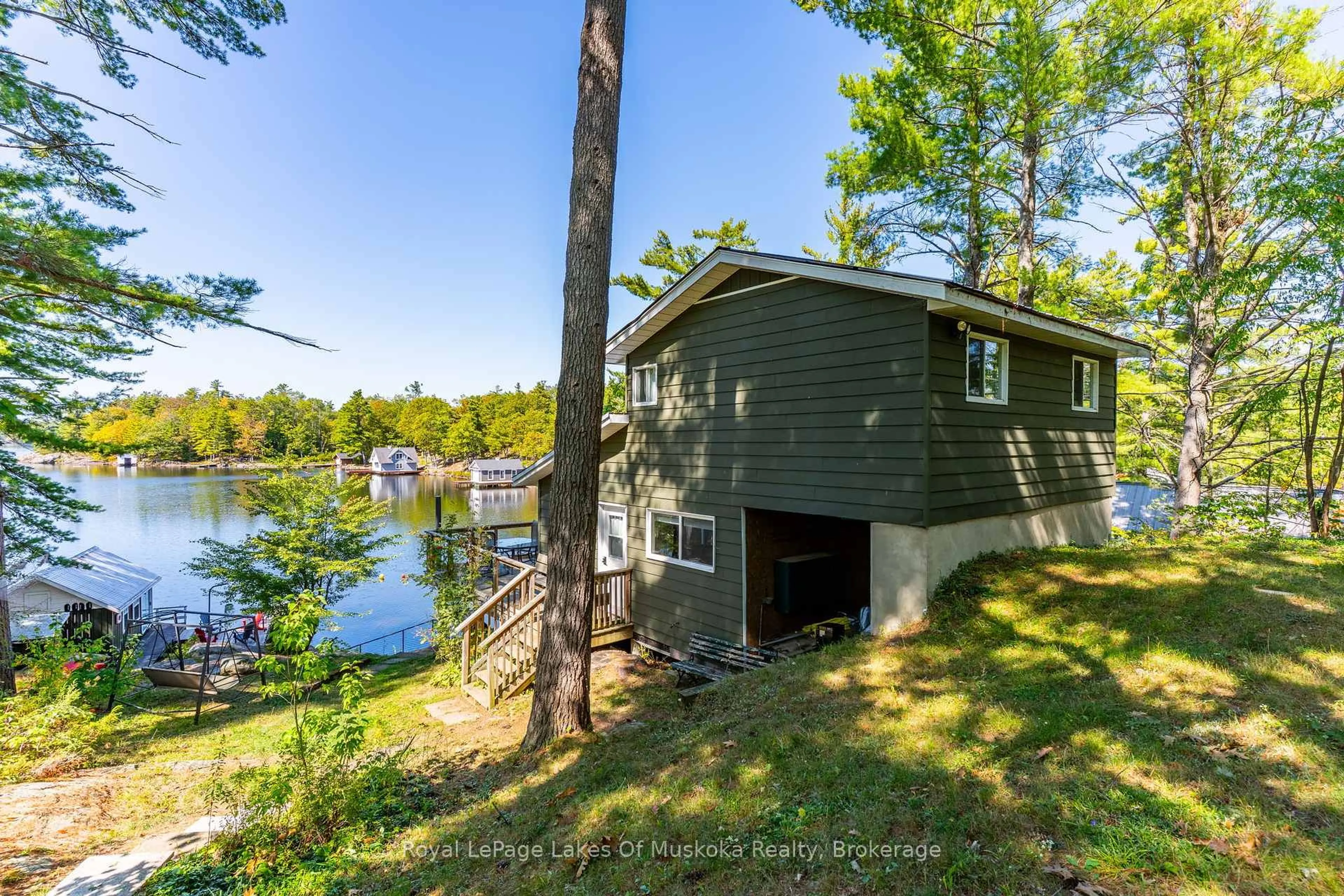 A pic from outside/outdoor area/front of a property/back of a property/a pic from drone, water/lake/river/ocean view for 1379 Muskoka Road 169 #4, Gravenhurst Ontario P1P 1R2