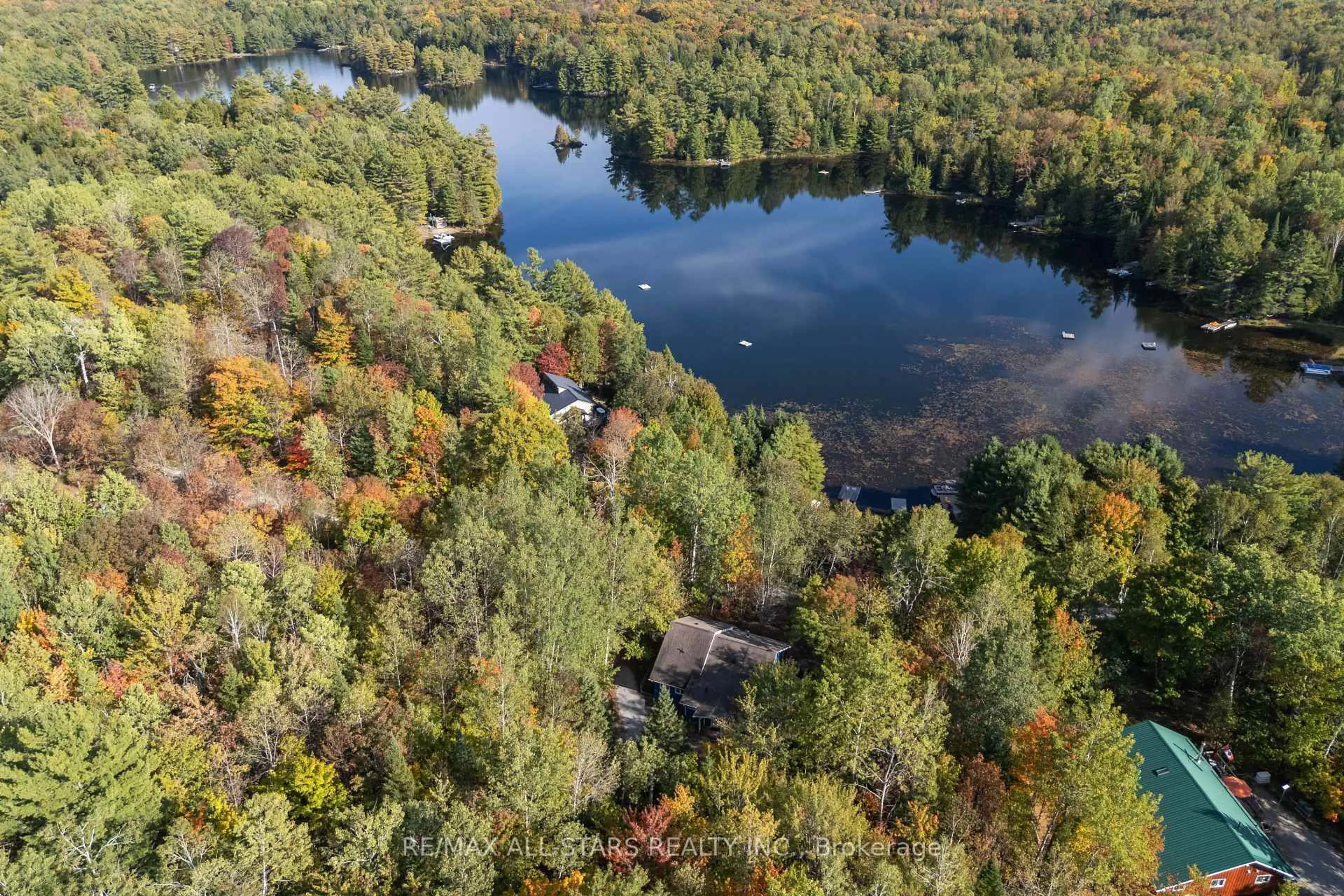 A pic from outside/outdoor area/front of a property/back of a property/a pic from drone, water/lake/river/ocean view for 1142 English Circ, Highlands East Ontario K0M 1R0