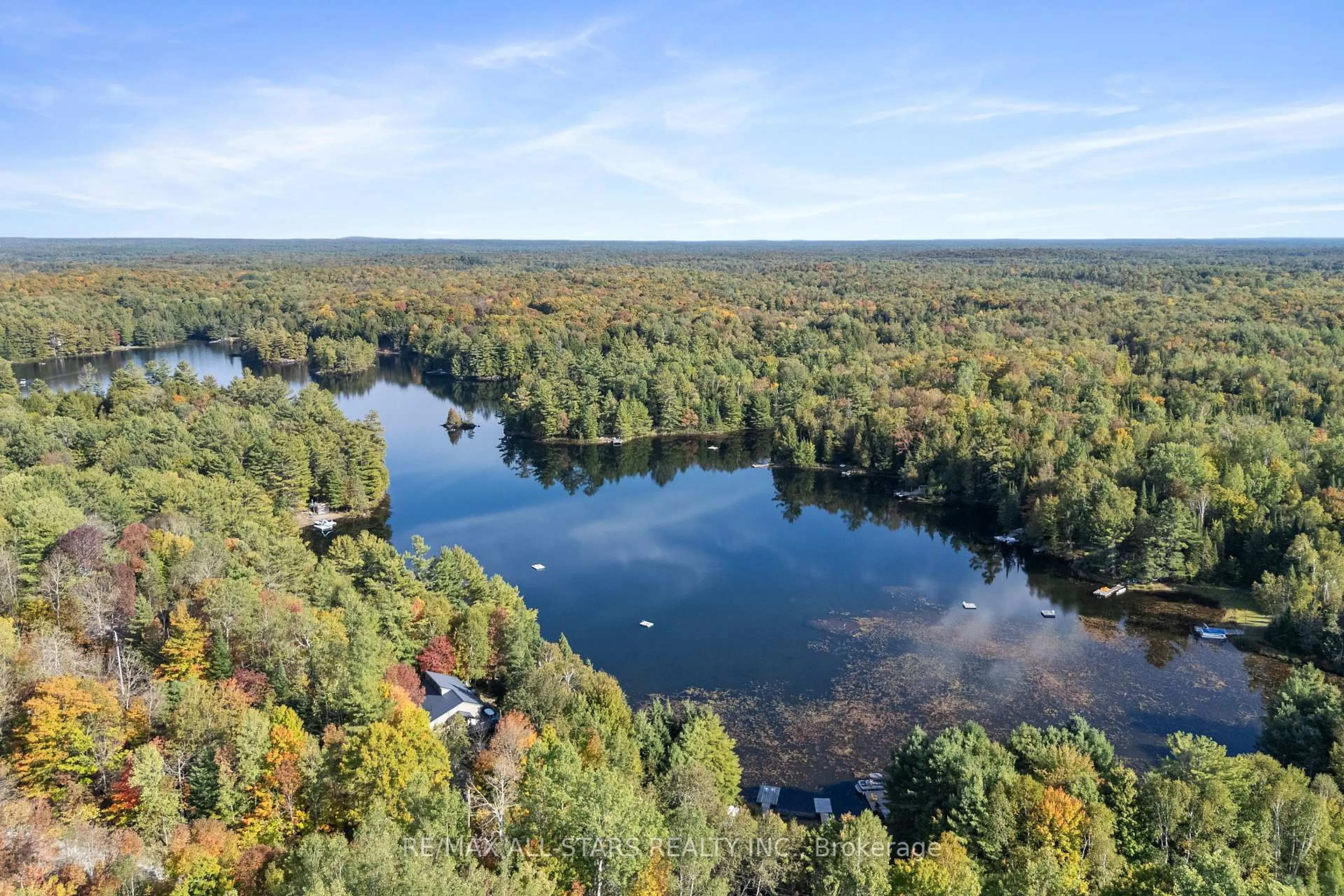 A pic from outside/outdoor area/front of a property/back of a property/a pic from drone, water/lake/river/ocean view for 1142 English Circ, Highlands East Ontario K0M 1R0