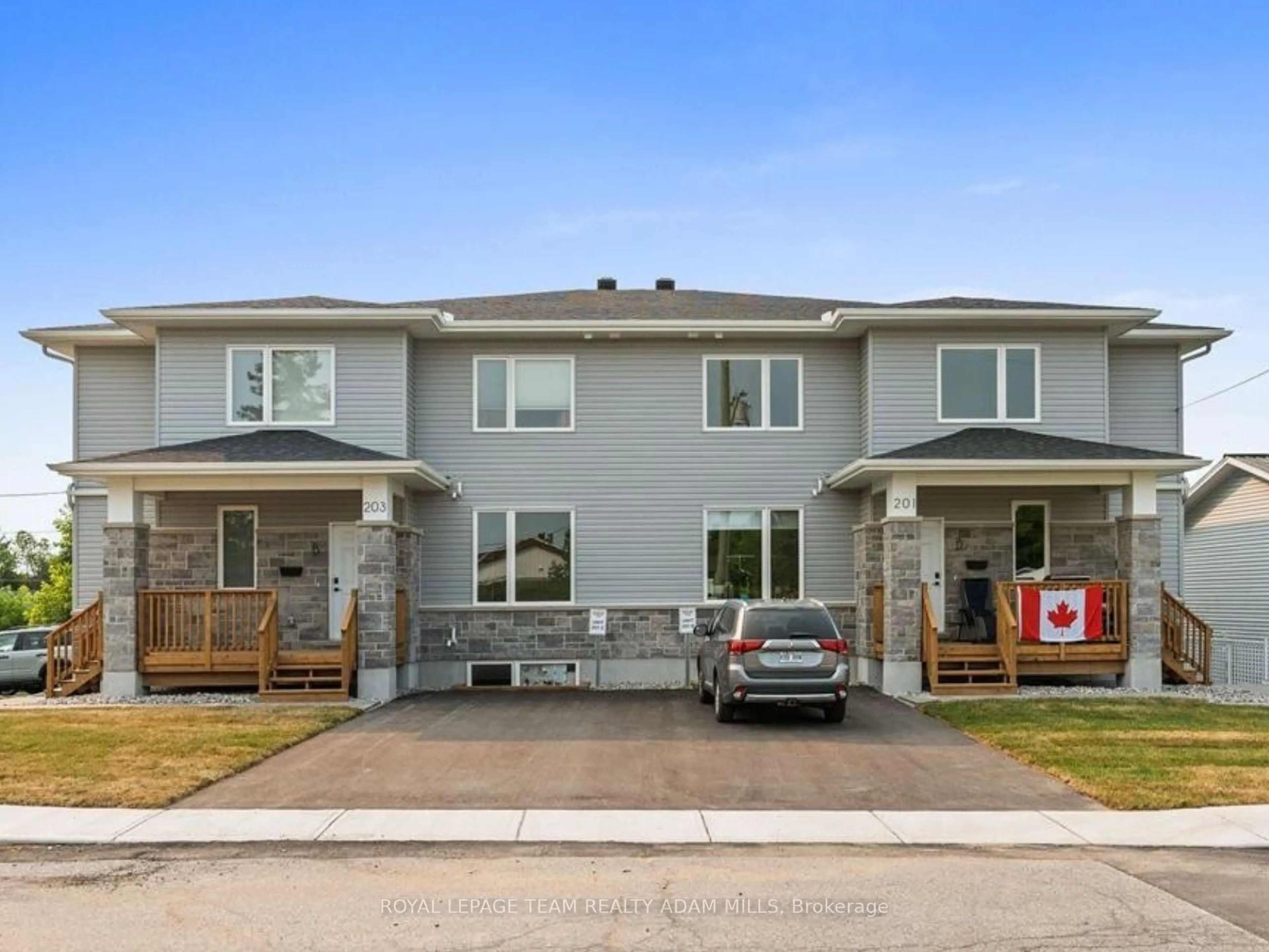 Home with vinyl exterior material, street for 201-203 Teskey St, Almonte Ontario K0A 1A0