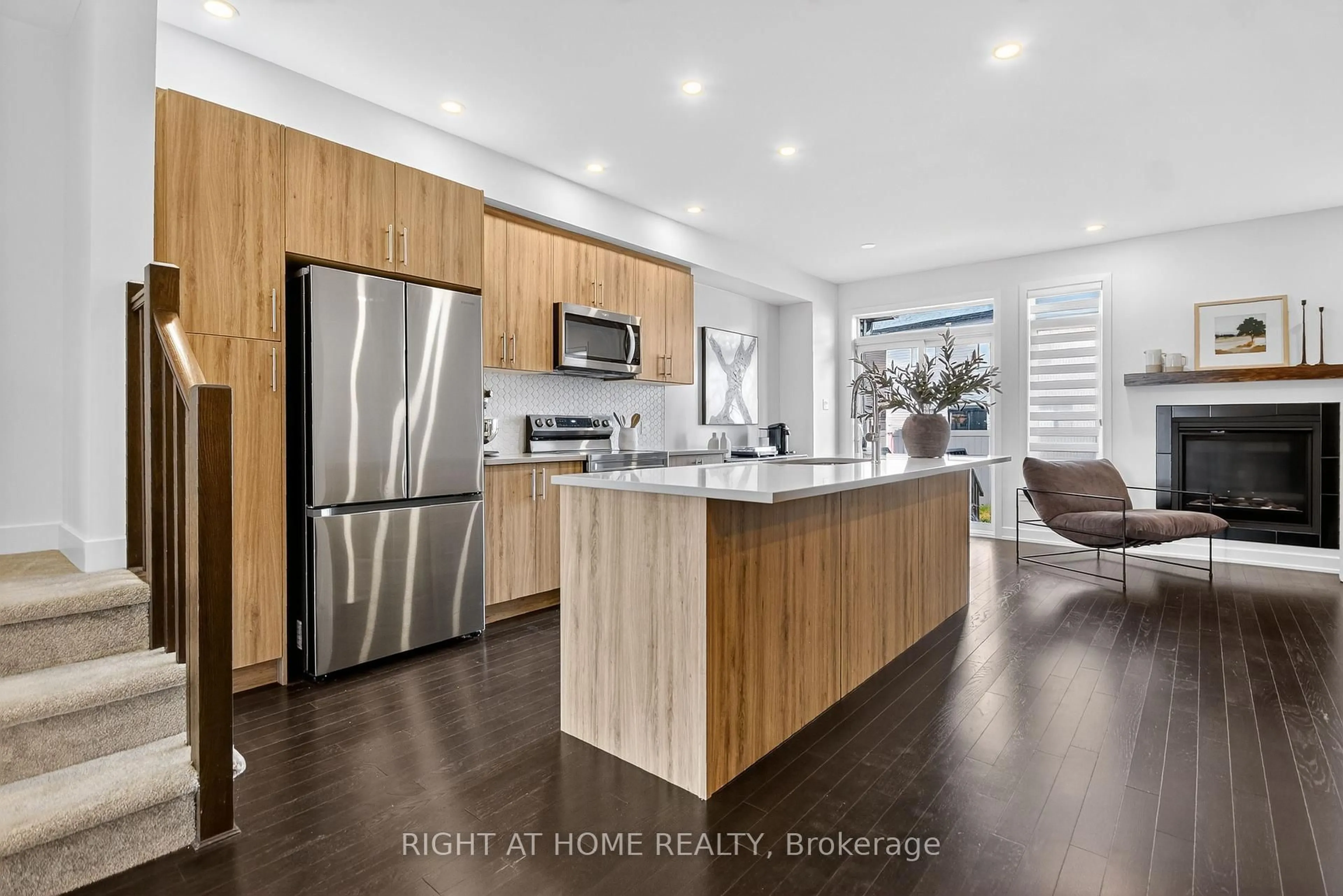 Open concept kitchen, wood/laminate floor for 2329 Goldhawk Dr, Ottawa Ontario K2S 2X3