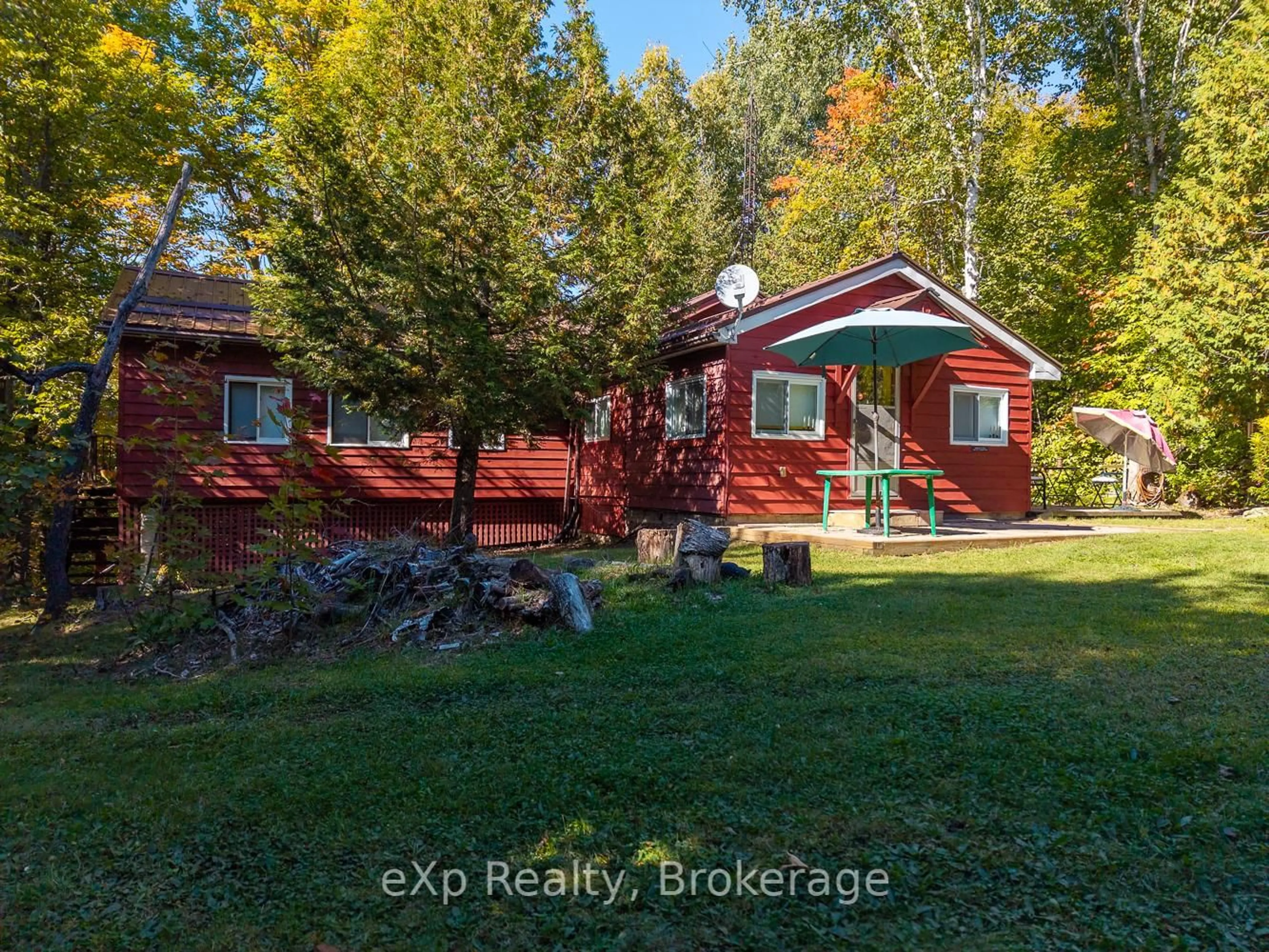 A pic from outside/outdoor area/front of a property/back of a property/a pic from drone, unknown for 32 McKellar Lake Rd, McKellar Ontario P0G 1C0